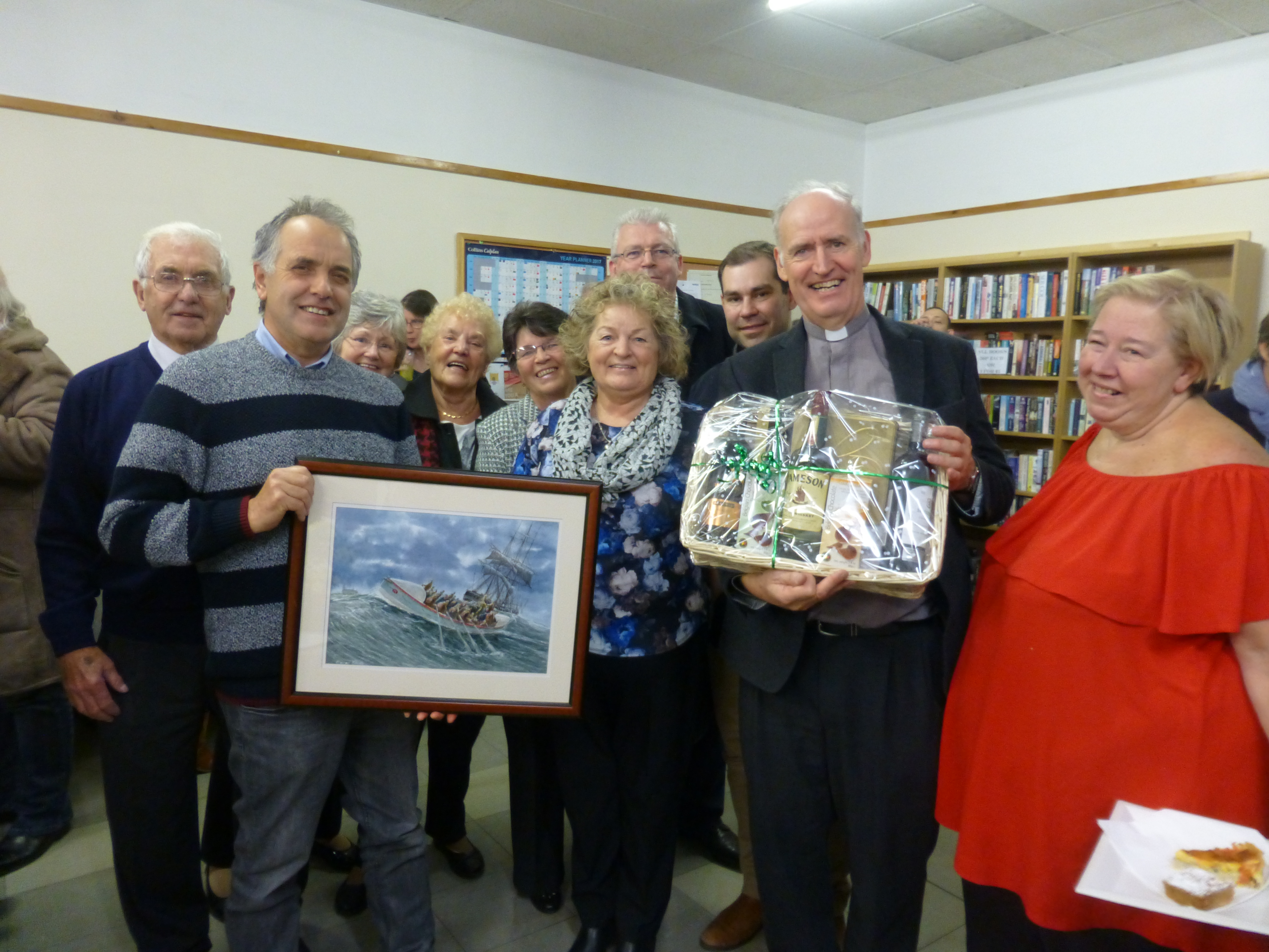 Peter is presented with gifts to thank him for his volunteer service to Newbiggin lifeboat