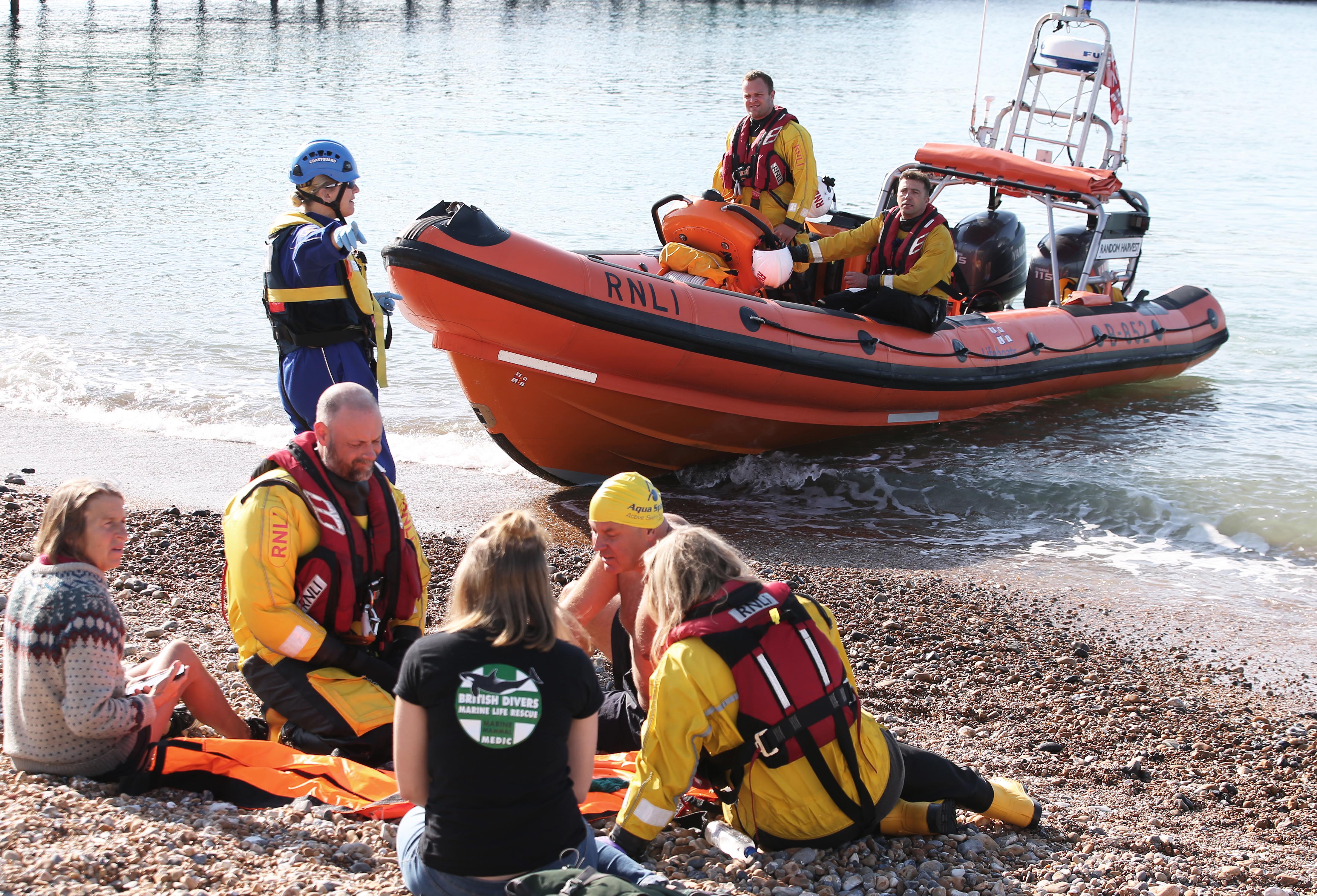 The scene on the beach as the Brighton Atlantic 85 lifeboat stands by