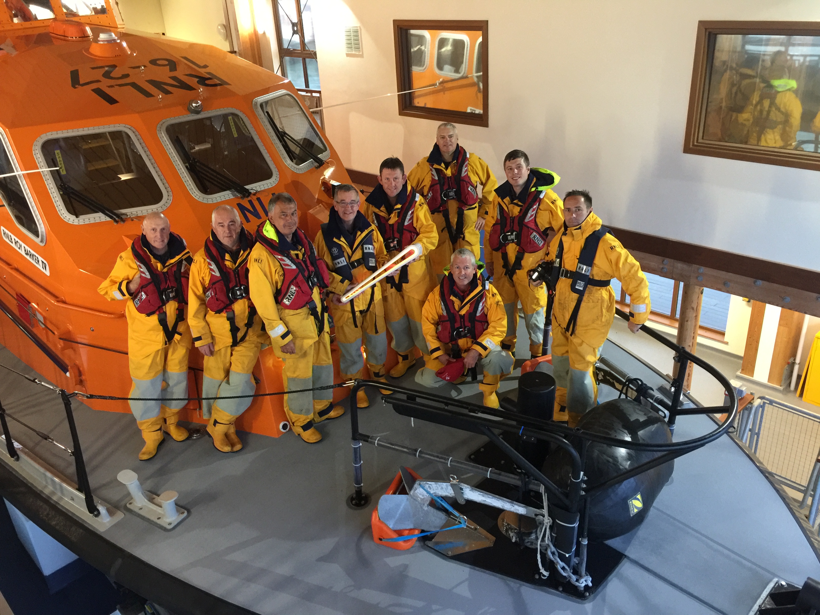 Crew on deck of Roy Barker IV with the baton