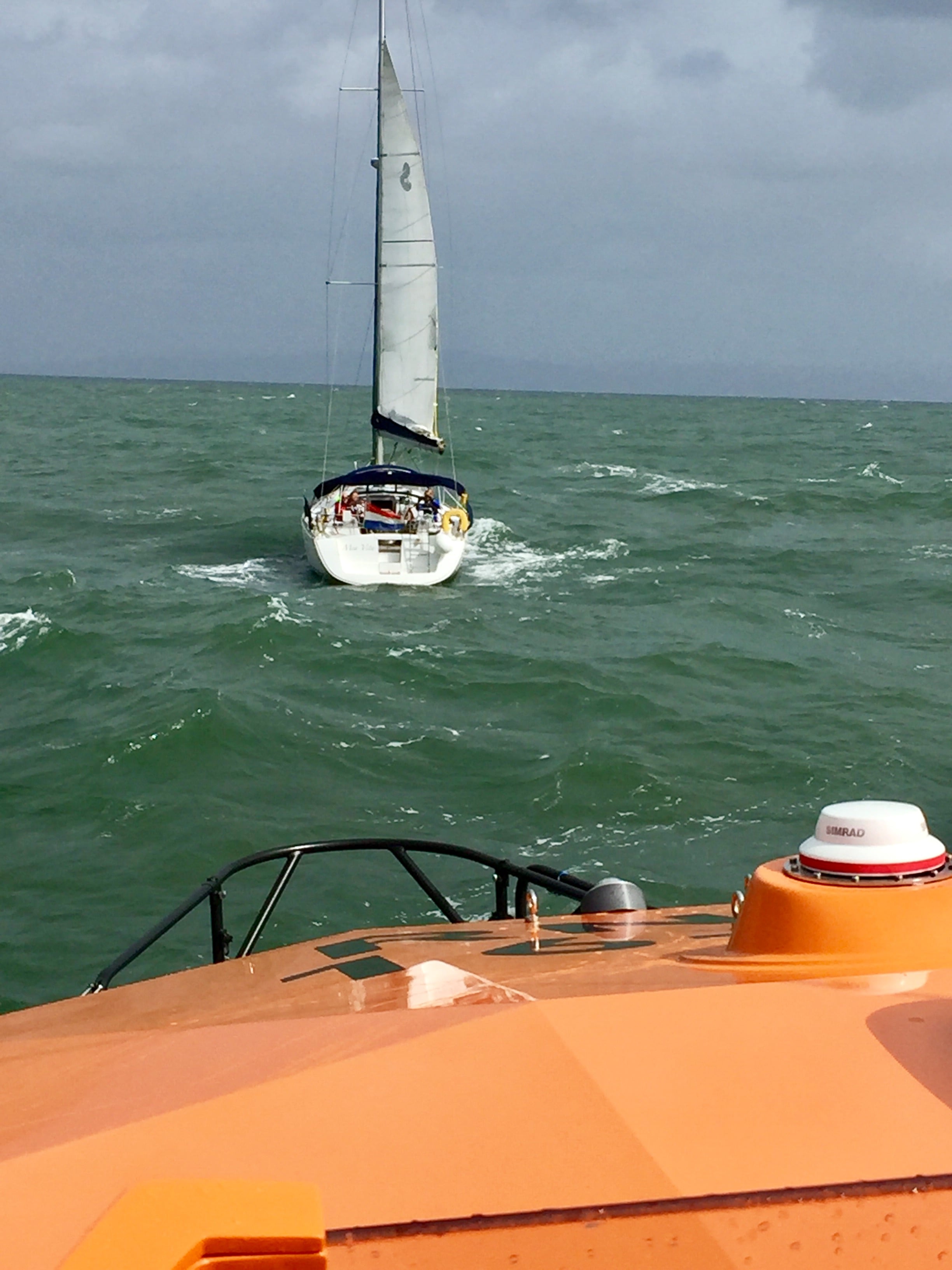 43ft yacht sails to Swansea while being escorted by The Mumbles All Weather lifeboat.
