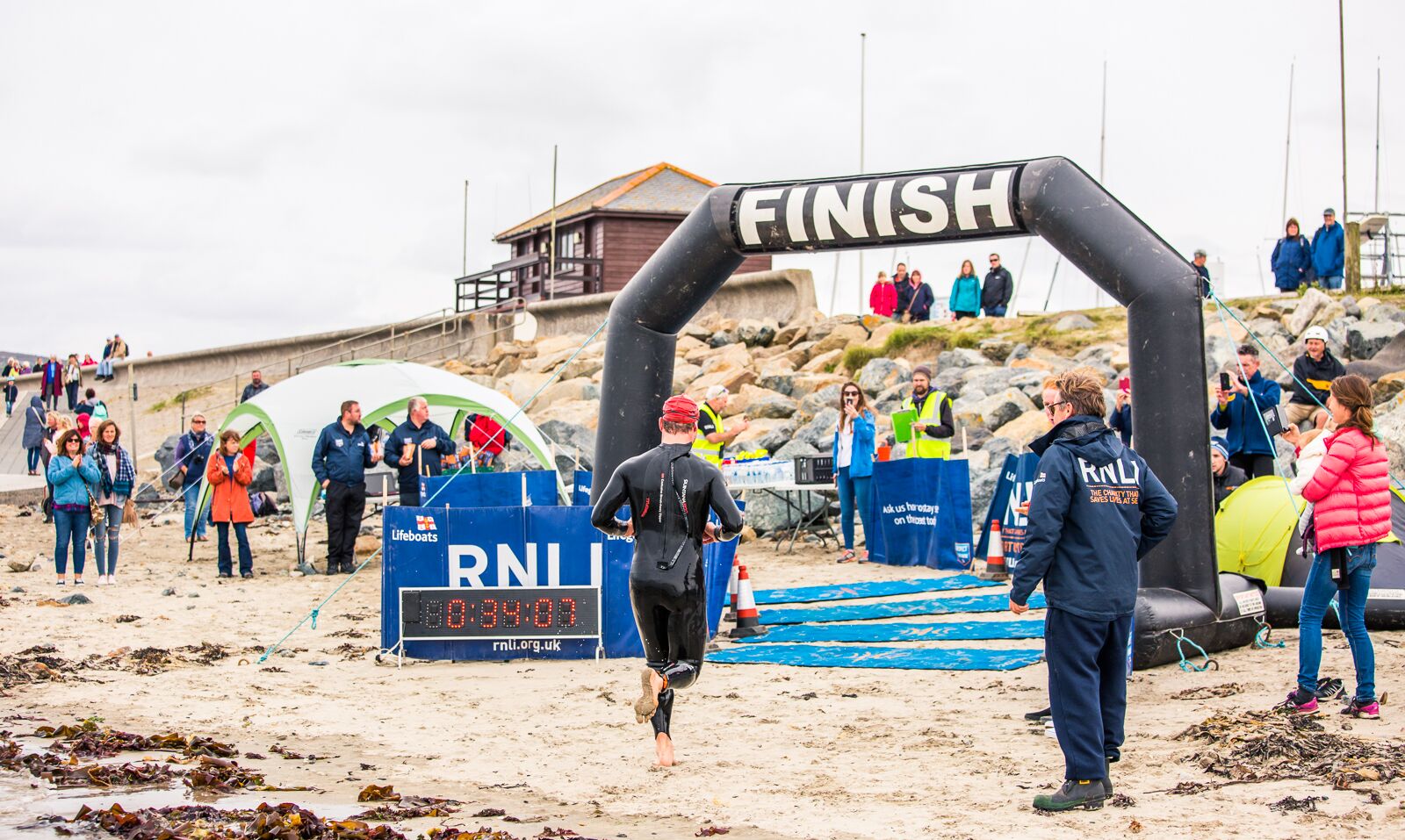 First swimmer over Finish line 
