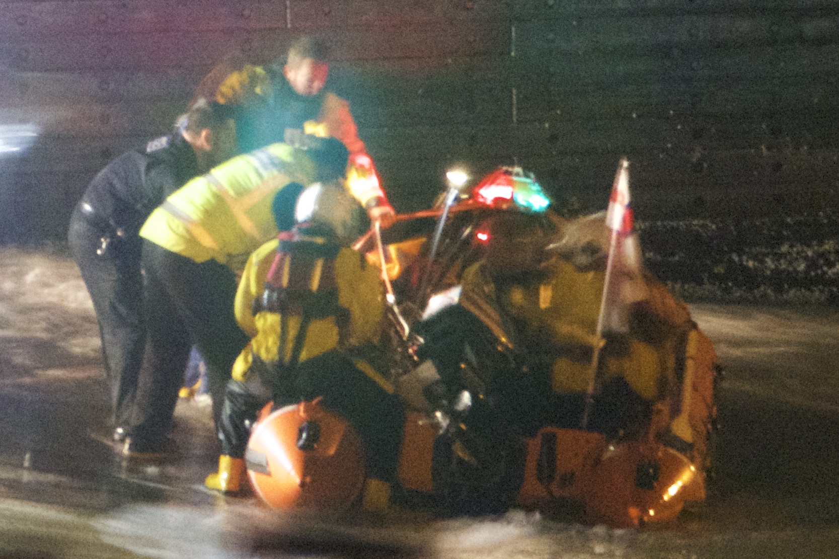 Dart lifeboat and Coastguard volunteers, along with the Police, gently lifted the casualty from the lifeboat on the Ferry slip.