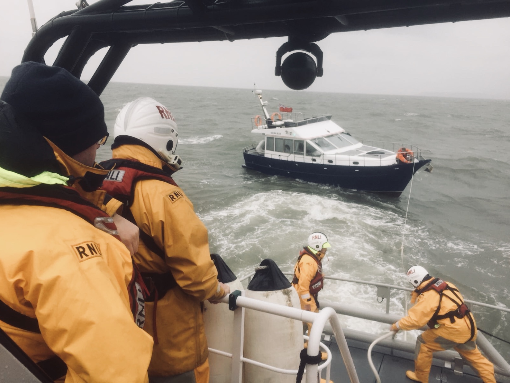 Crew on deck assemble a tow