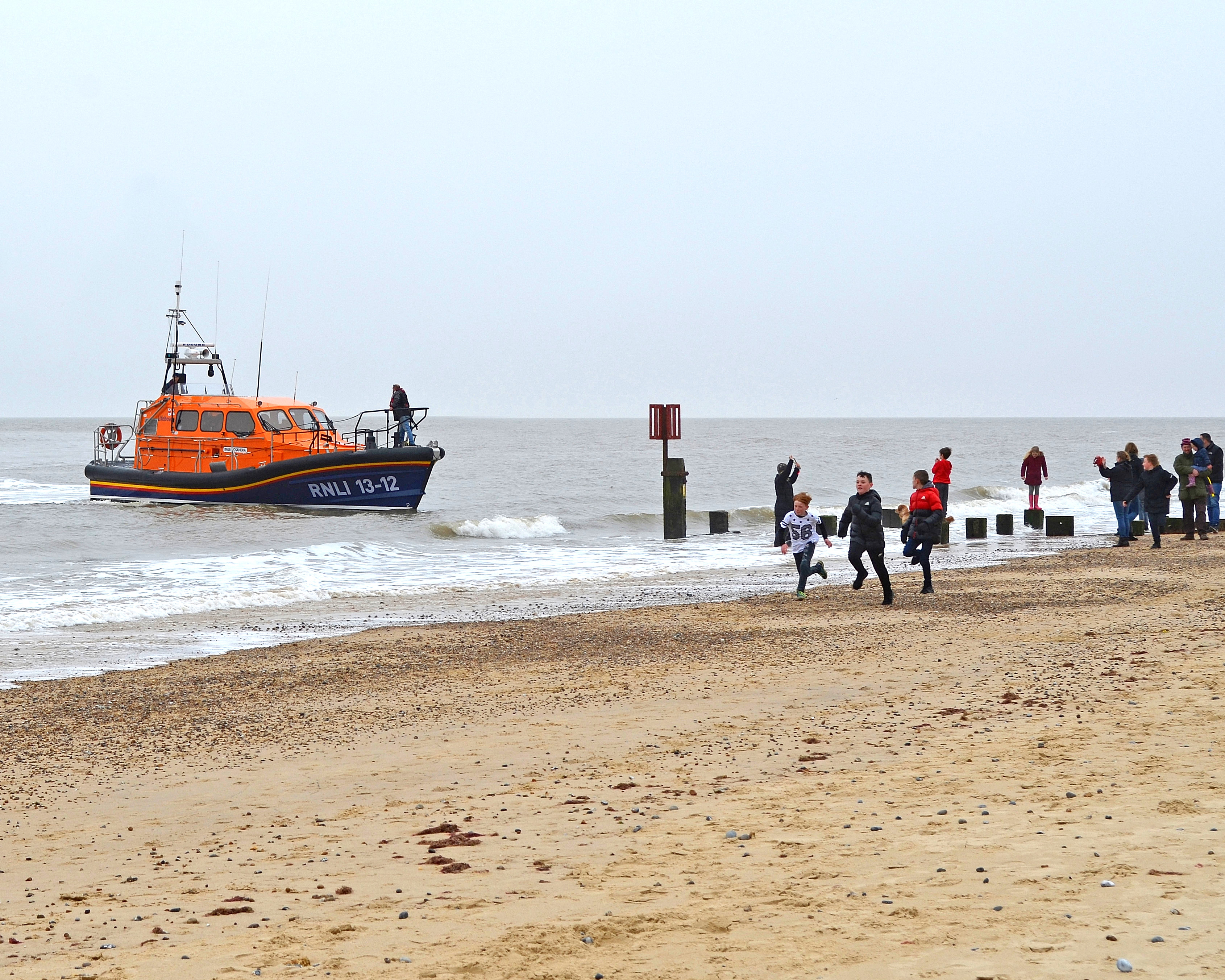 The Lowestoft crew on relief RNLI lifeboat 'Cassandra' delight concerned onlookers with news that the dog has been rescued