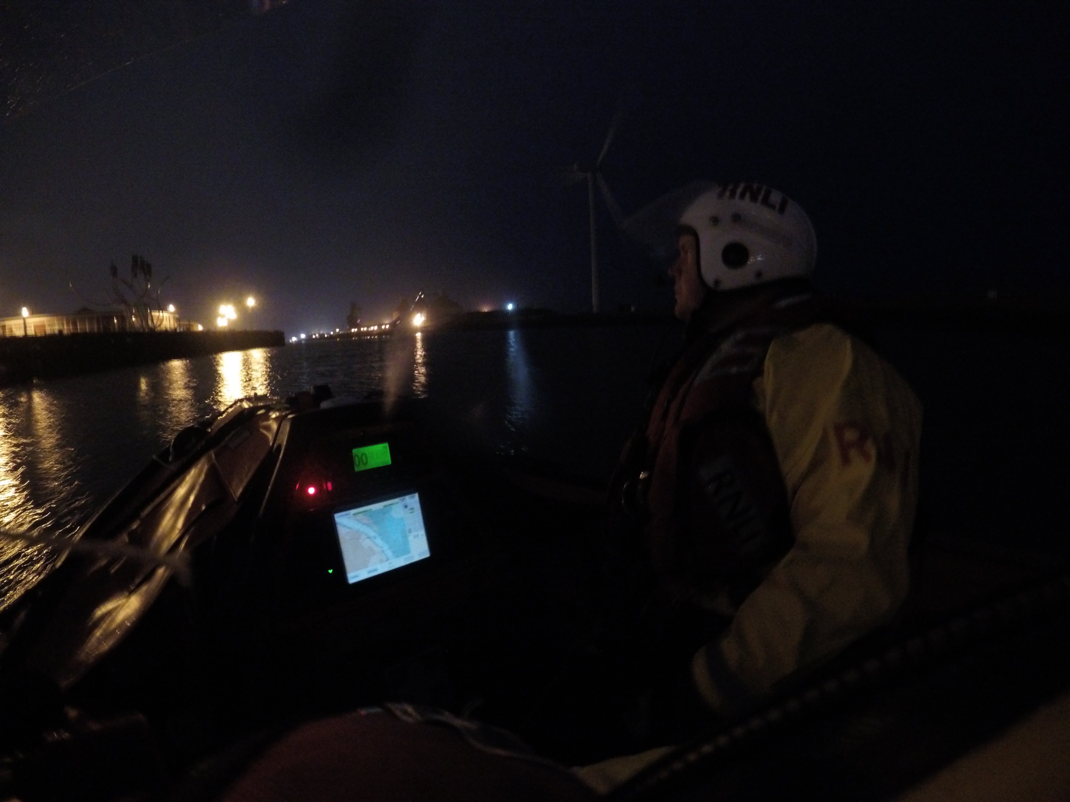 D Class lifeboat at night on the River Blyth postioned just off the Quayside