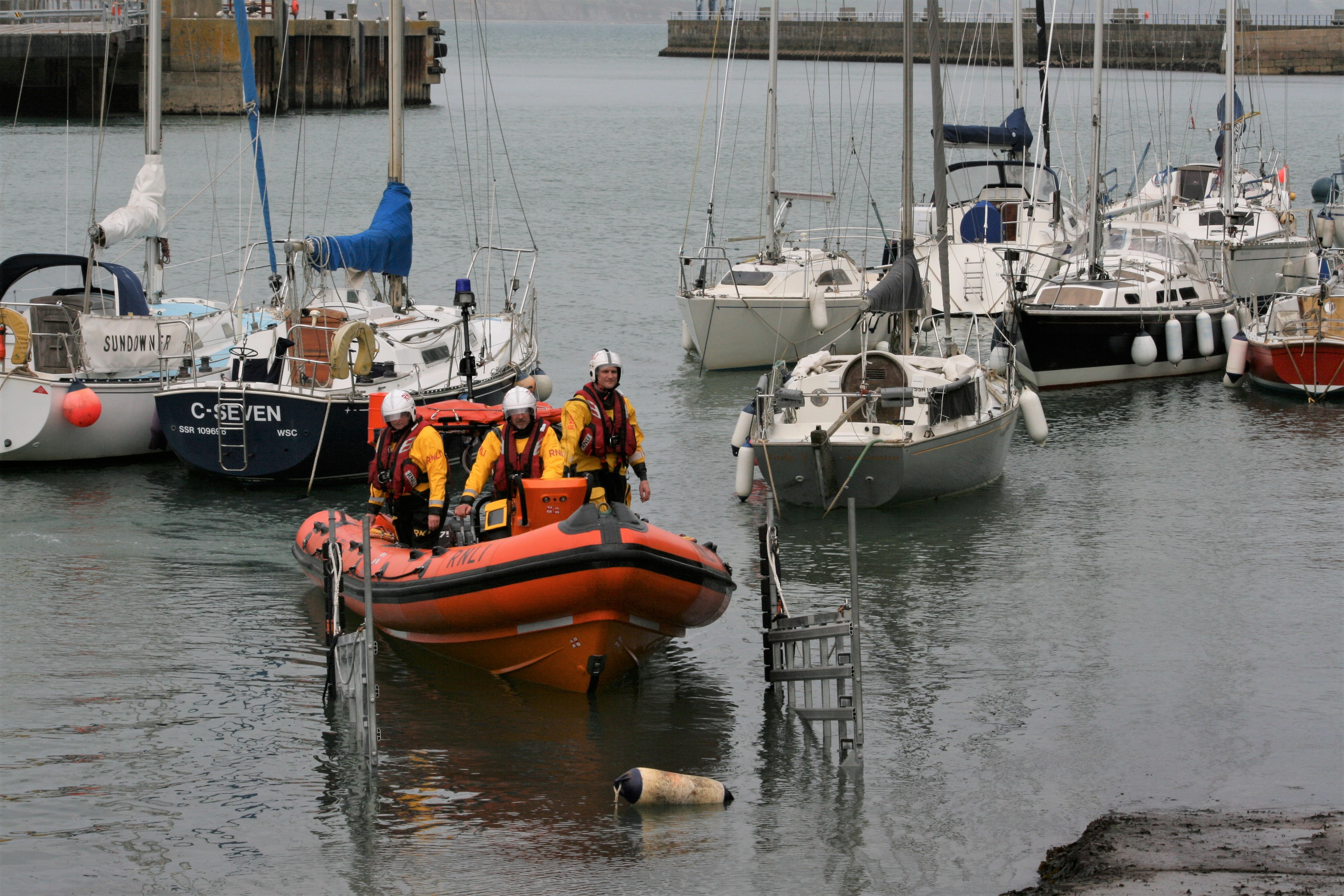 Weymouth Inshore lifeboat being recovered after shout.