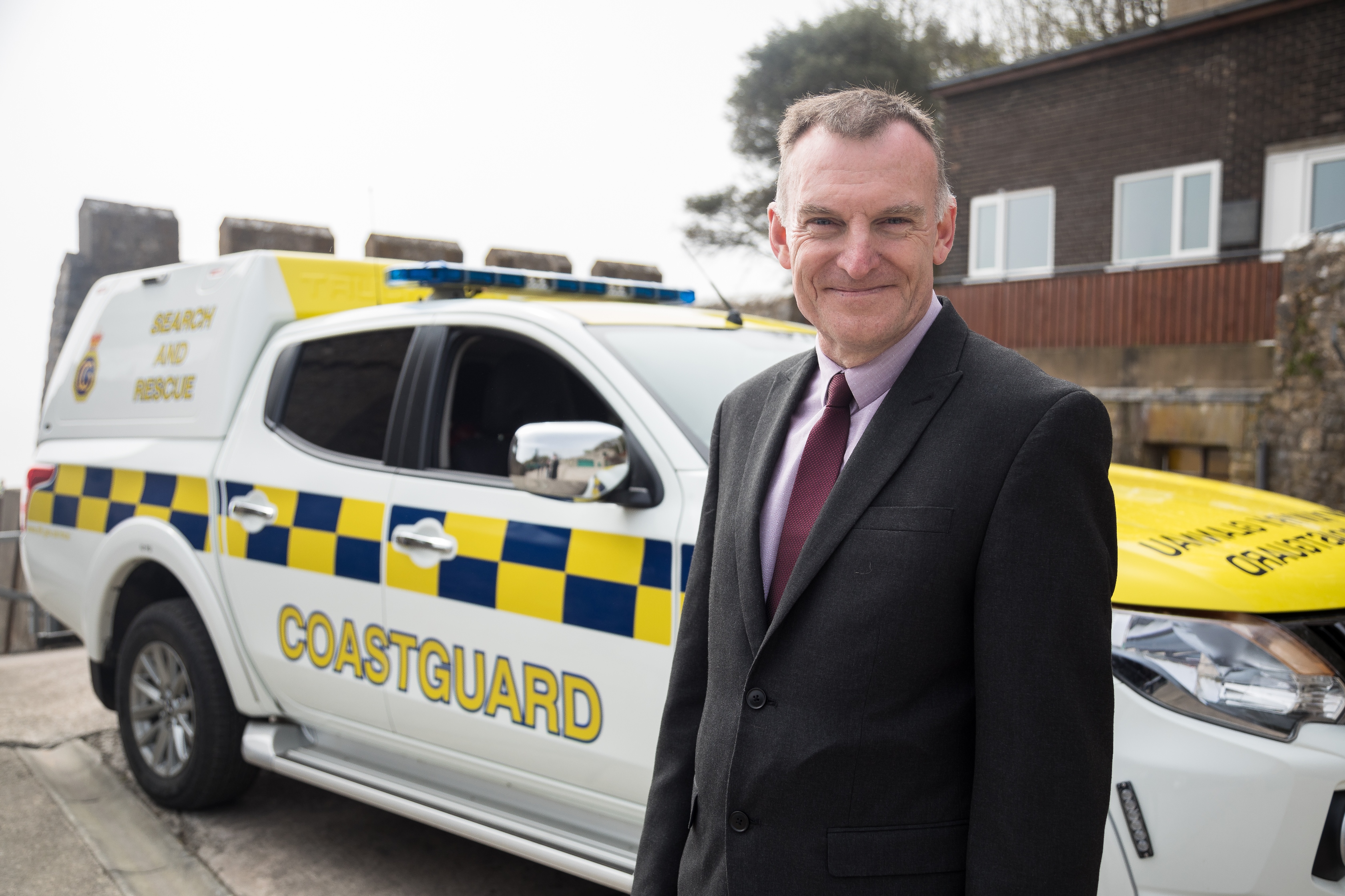 Phil Hanson, Aviation Technical Assurance Manager at the MCA, smiling for the camera in front of an MCA truck