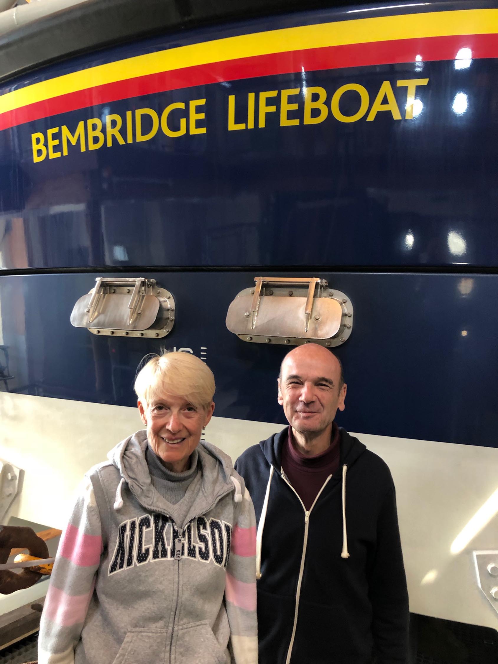 KT and Martin Bruce in front of the RNLI Bembridge Tamar boat