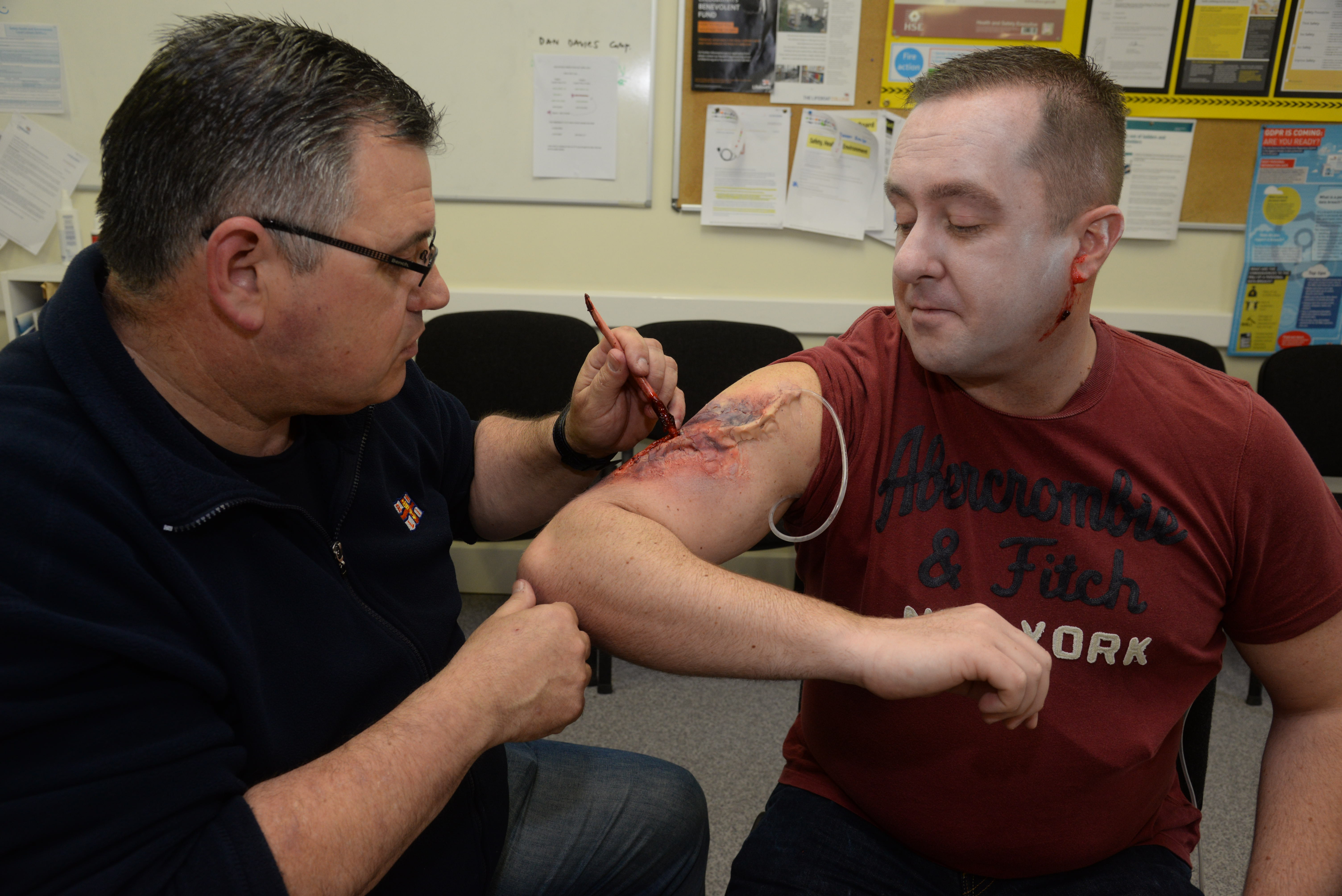 Mark Sidders applies the realistic injuries to casualty Ian Wood before the 2018 Whitstable Lifeboat 'Dan Davies' seamanship and first aid exercise on Saturday. Picture: Chris Davey/RNLI Whitstable.