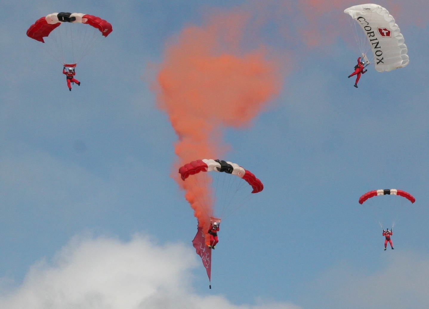 The Red Devils parachute display team dropping on Lyme Regi beach.