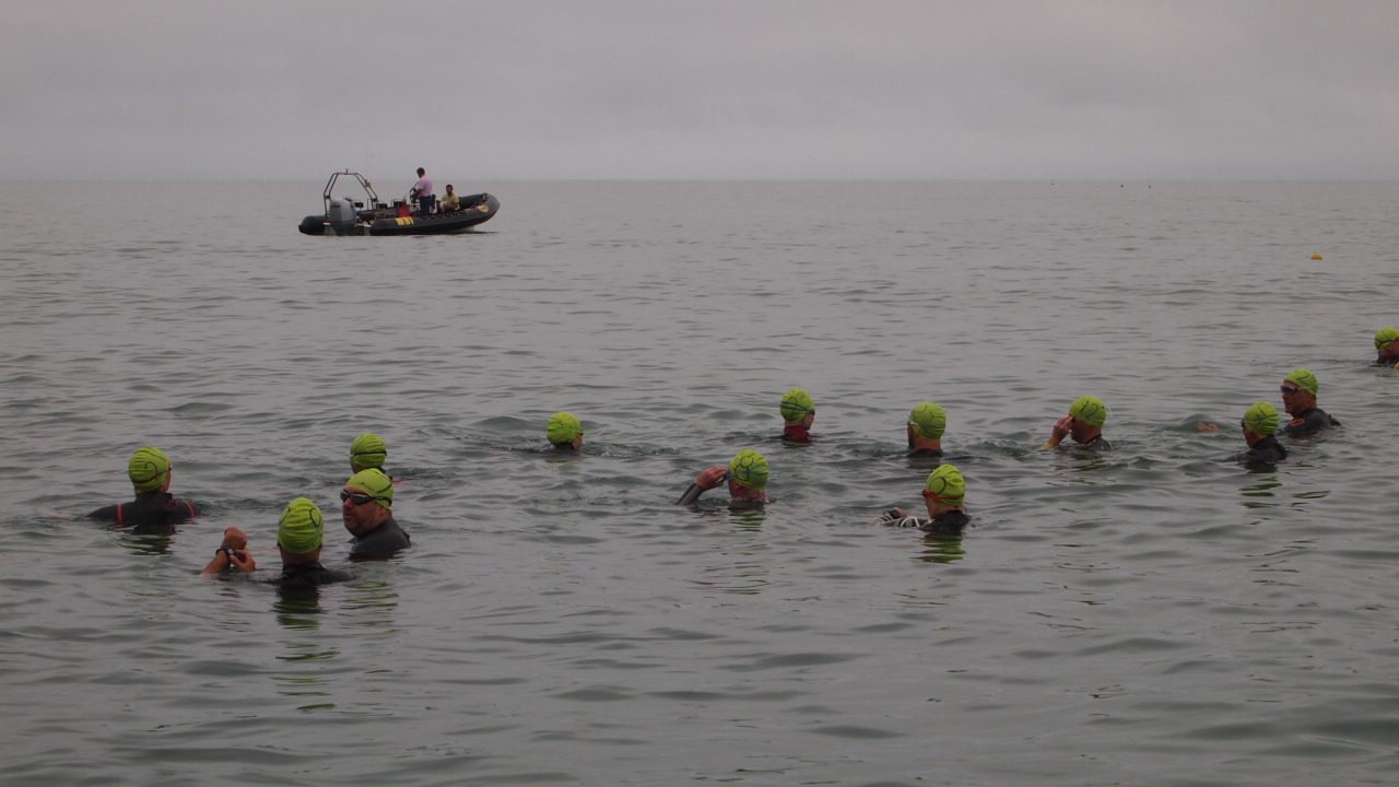 Swimmers in the water ready to start the swim.