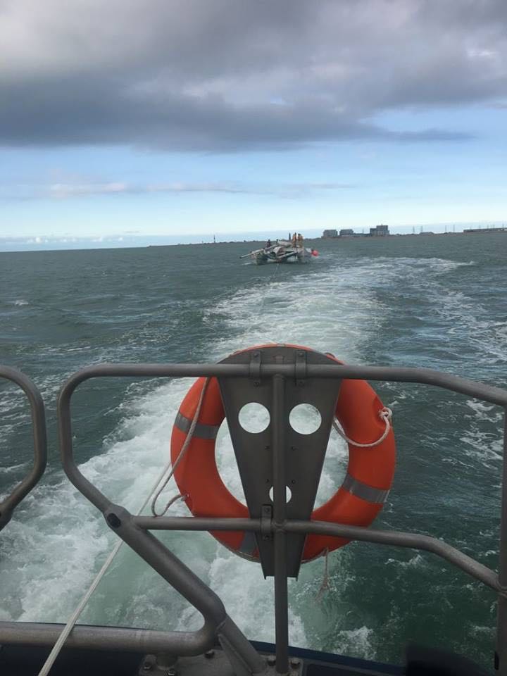 Stricken catamaran under tow by Dungeness RNLI lifeboat