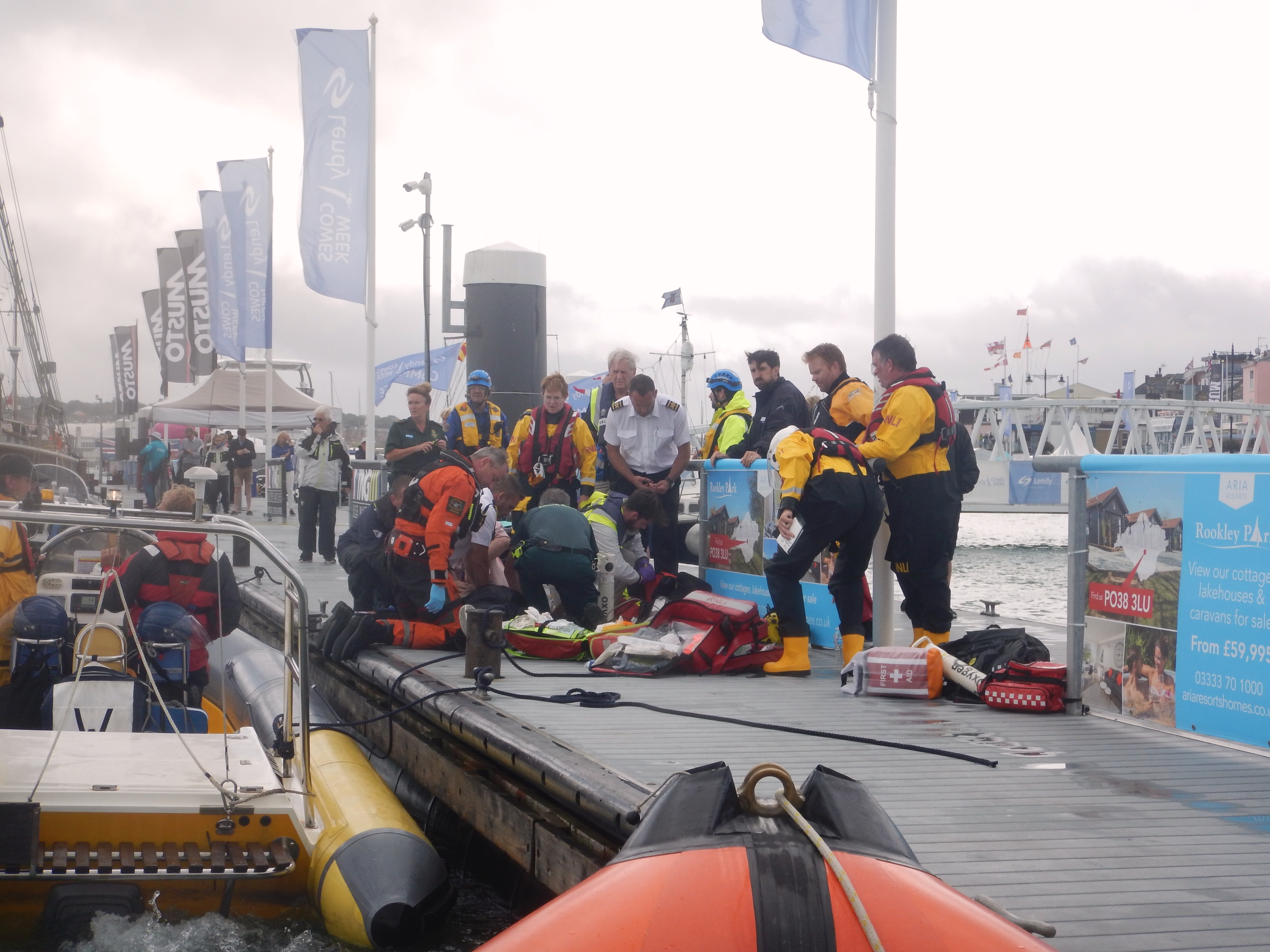 The scene on the Trinity Landing pontoon as desperate attempts were made to resuscitate the yachtsman.