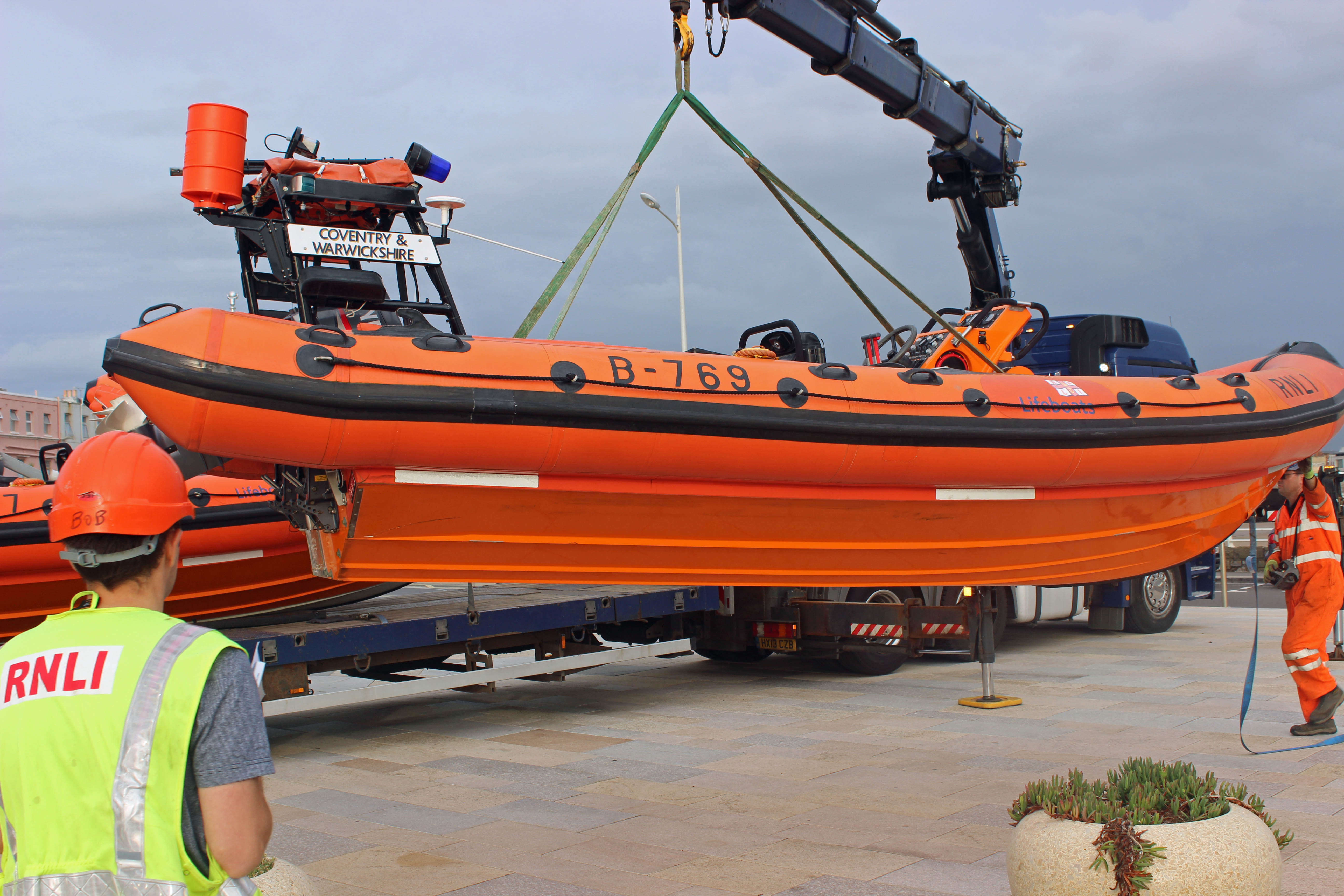 The old lifeboat being lifted onto the ground prior to going on the lorry