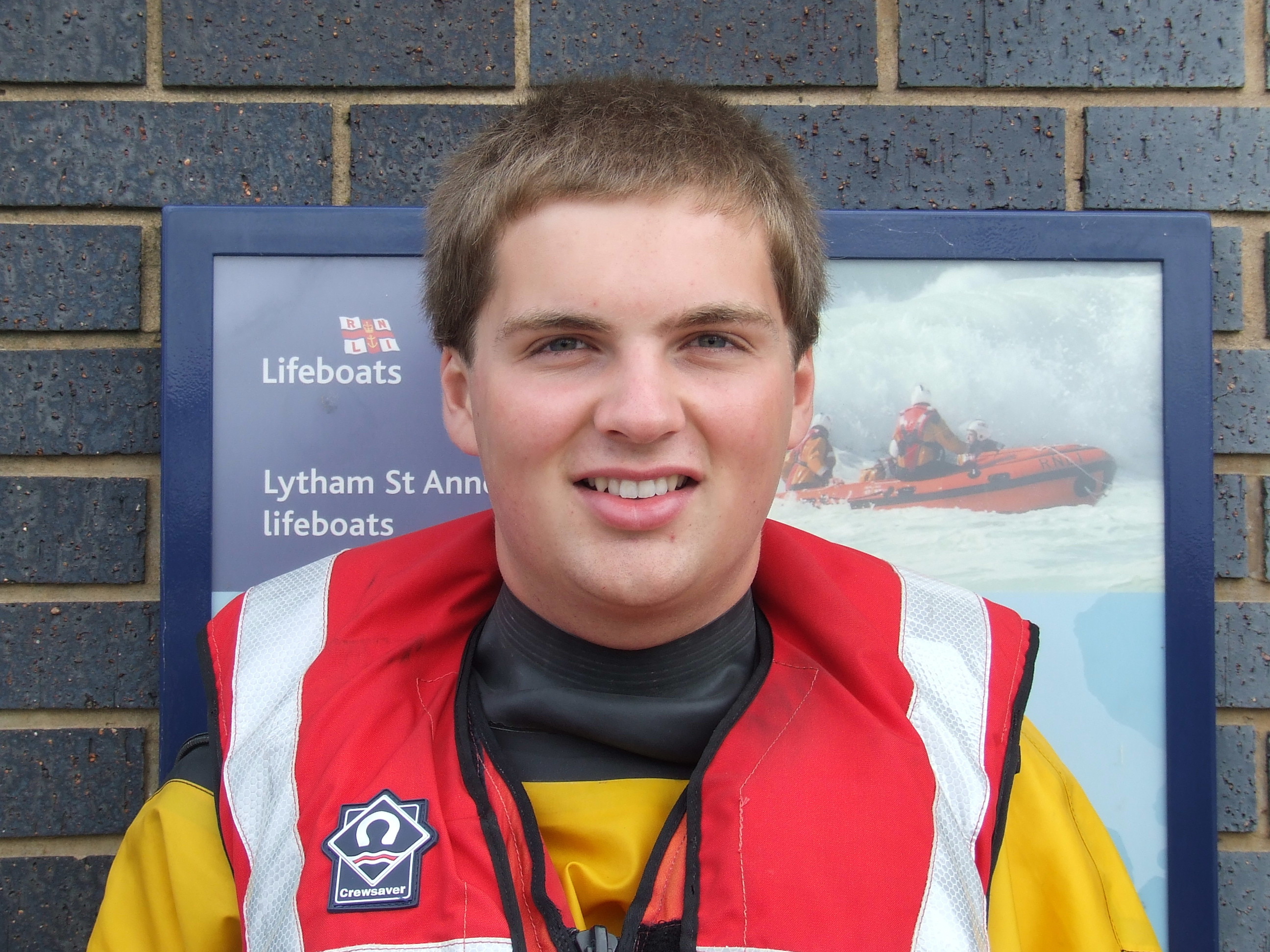 A lifeboat crew member in life-jacket and dry suit