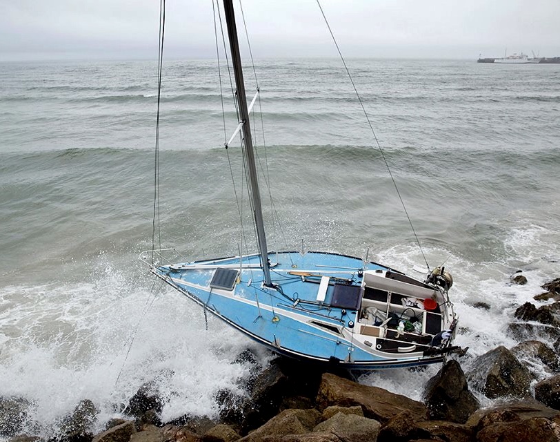 Yacht aground on rocks