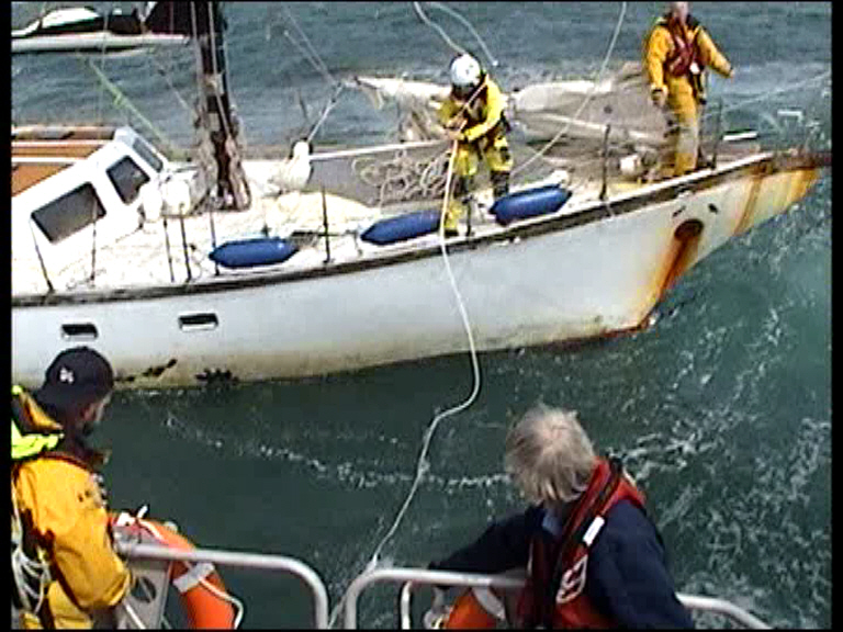 Heaving line thrown to casualty vessel to pass tow line from lifeboat.