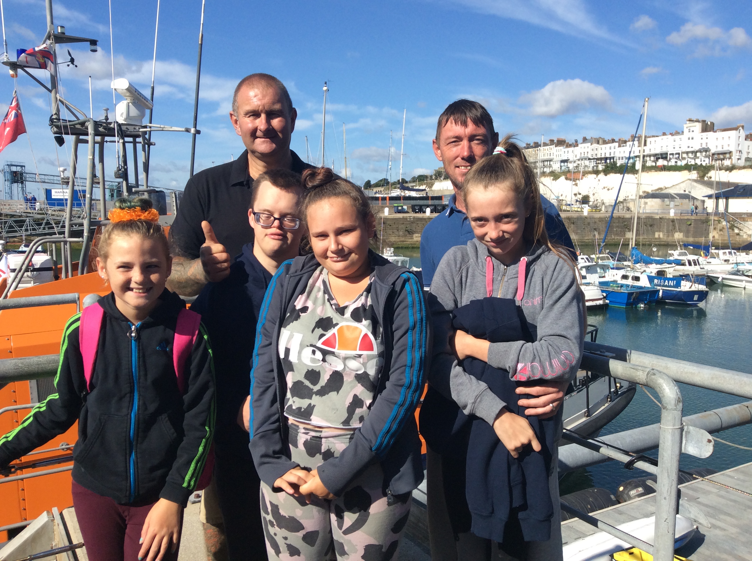 RNLI volunteer Jason Parrott with some excited children about to go fishing.