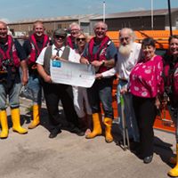 Volunteers of Fleetwood RNLI receive a cheque from Geoff and Debbie Cann from the Dalton Arms and long time customer and supporter of RNLI, Tony Robinson