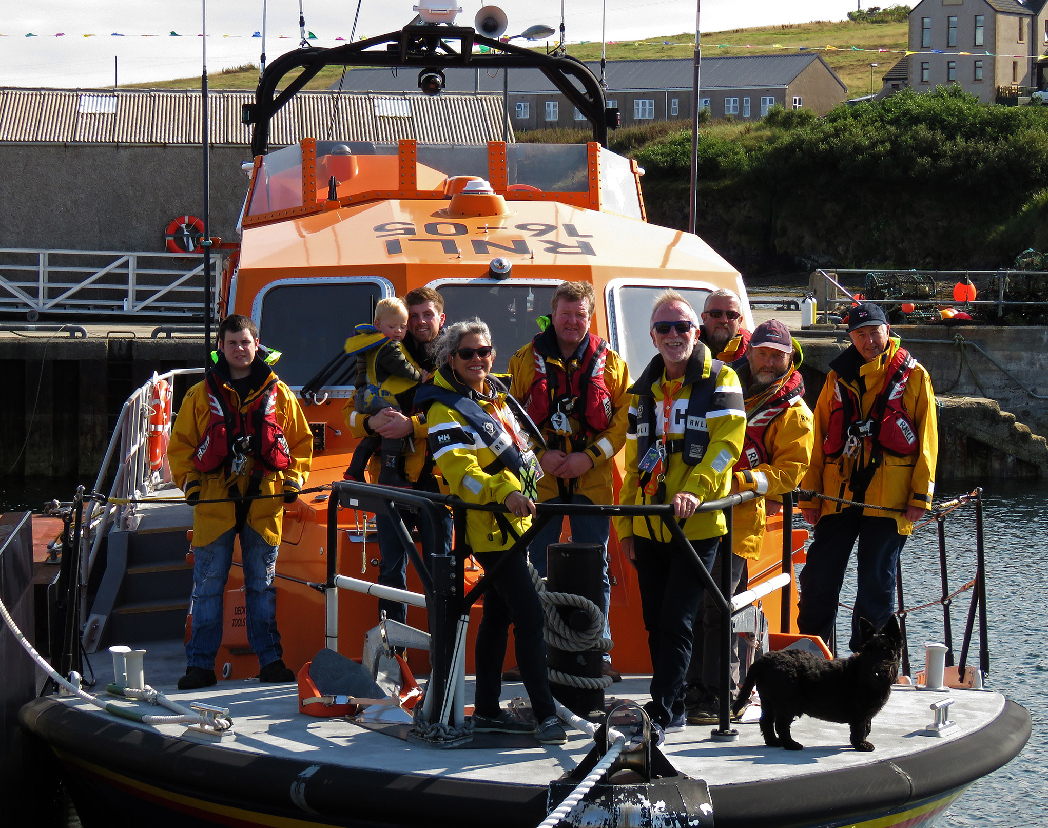 Belinda and James with crew members aboard Longhope lifeboat