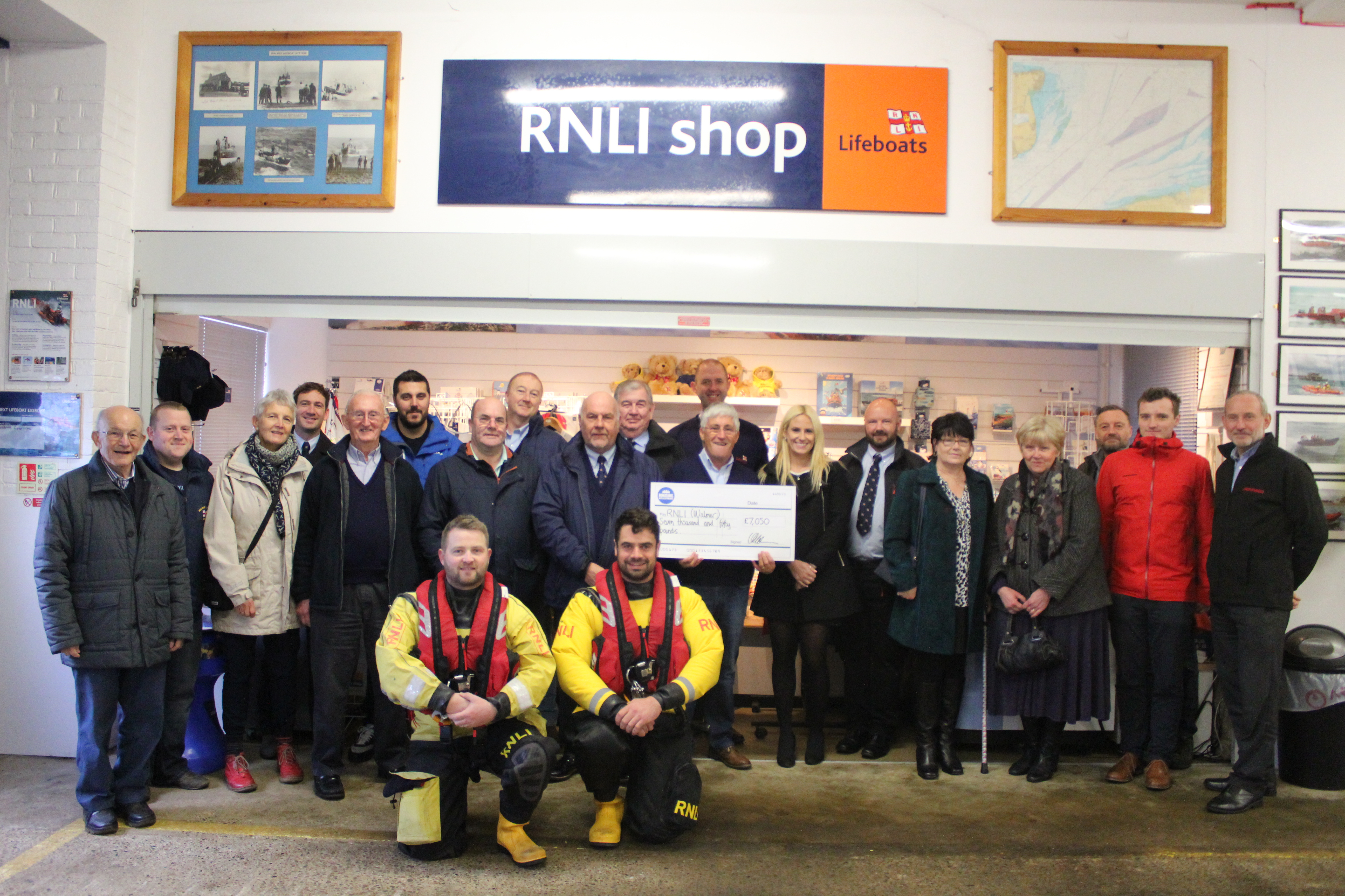 Lifeboat Operations Manager Denis Brophy receives donation cheque in memory of former crew member.