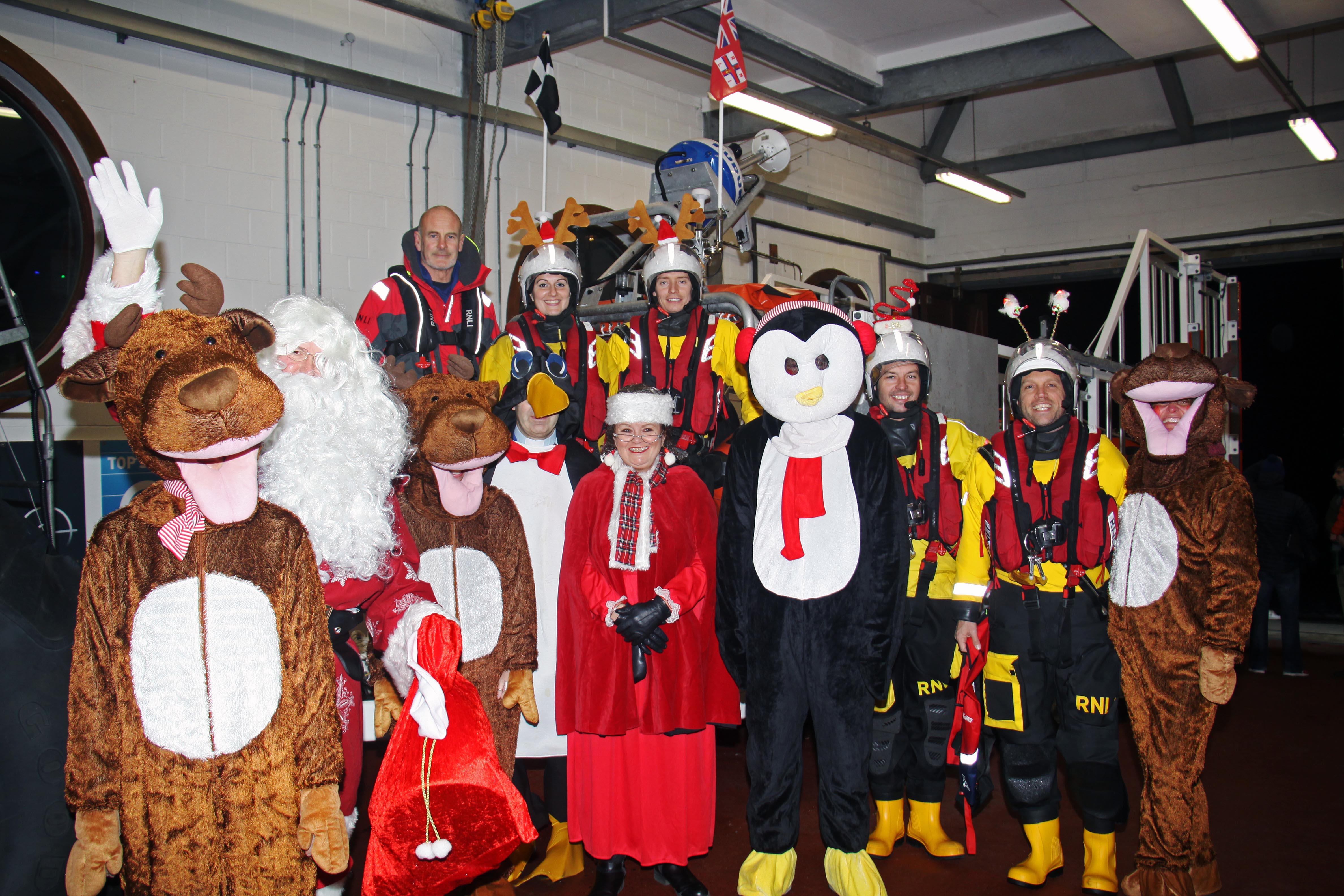 Santa and his helpers with Looe RNLI volunteer crew at Looe Lifeboat Station