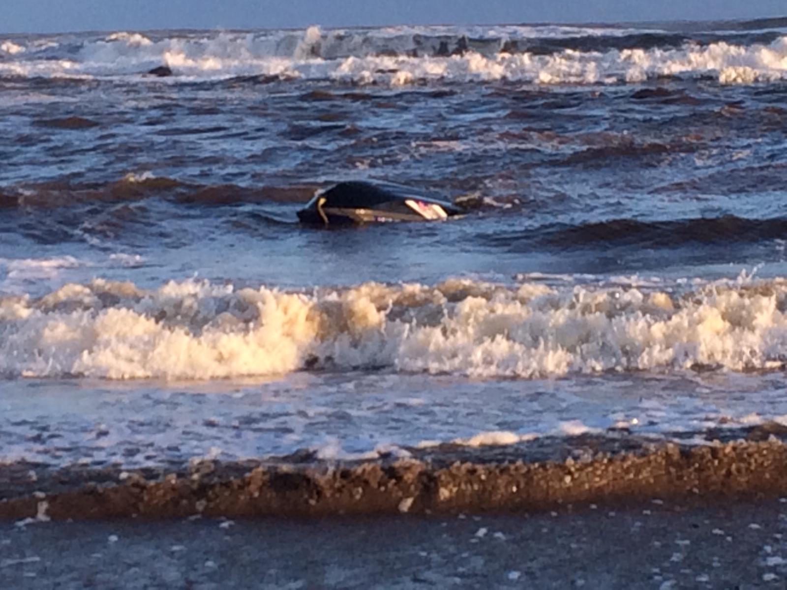 Upturned Jet Ski in Stonehaven Bay