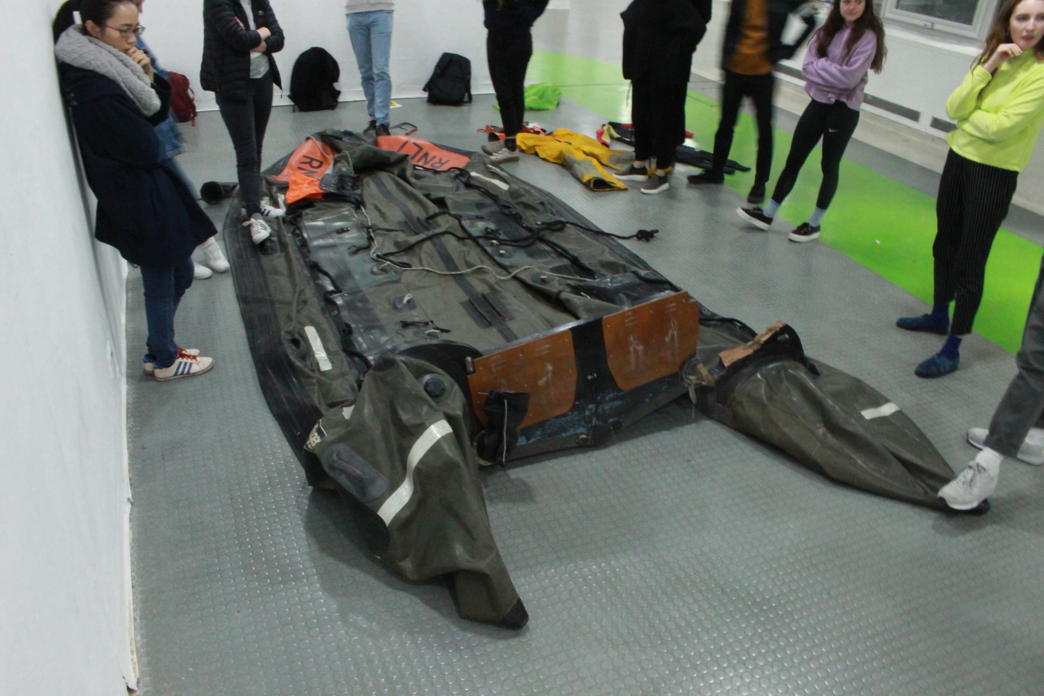 Royal College of Art students unpacking the decommissioned D class lifeboat for use in the project