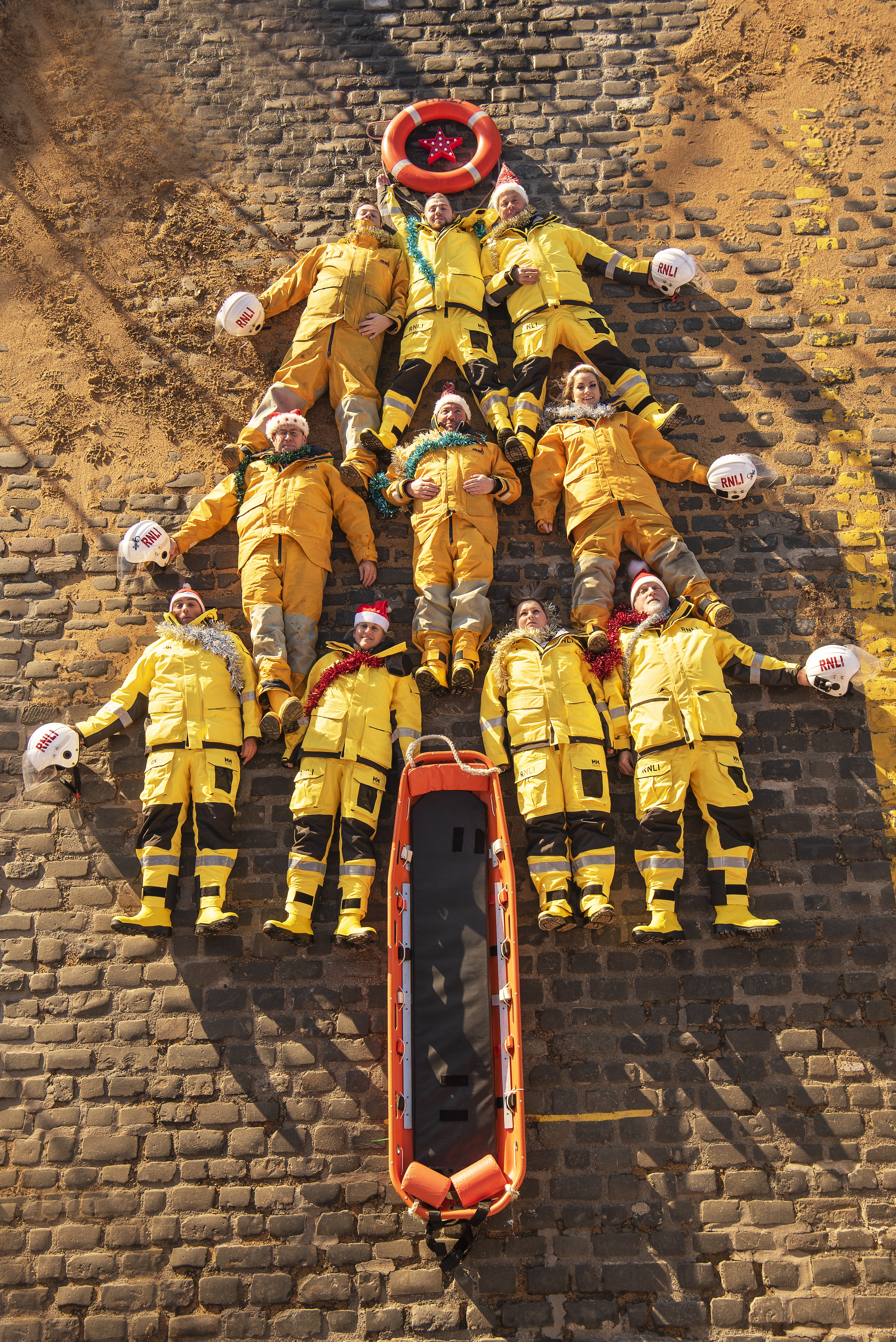 Anstruther volunteers lay down as a Christmas tree in festive photo fun