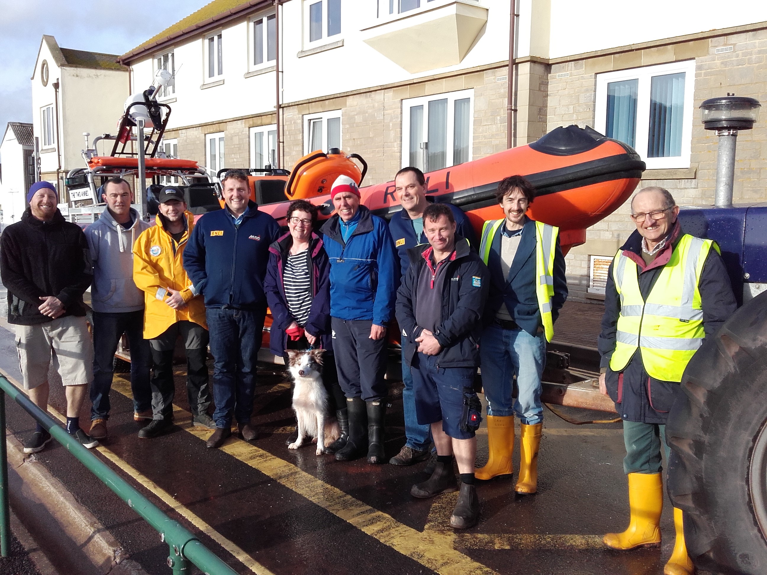 Jess and her owners Ruth and Brian with Teignmouth RNLI lifeboat crew