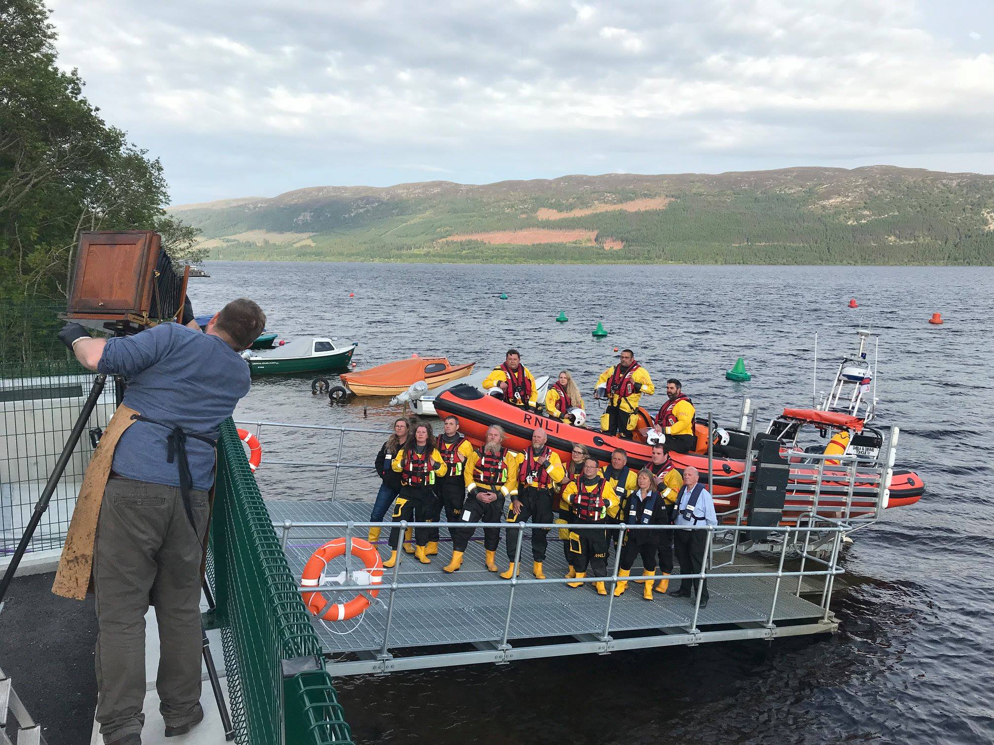 Jack Lowe prepares to take a photo of the Loch Ness RNLI team