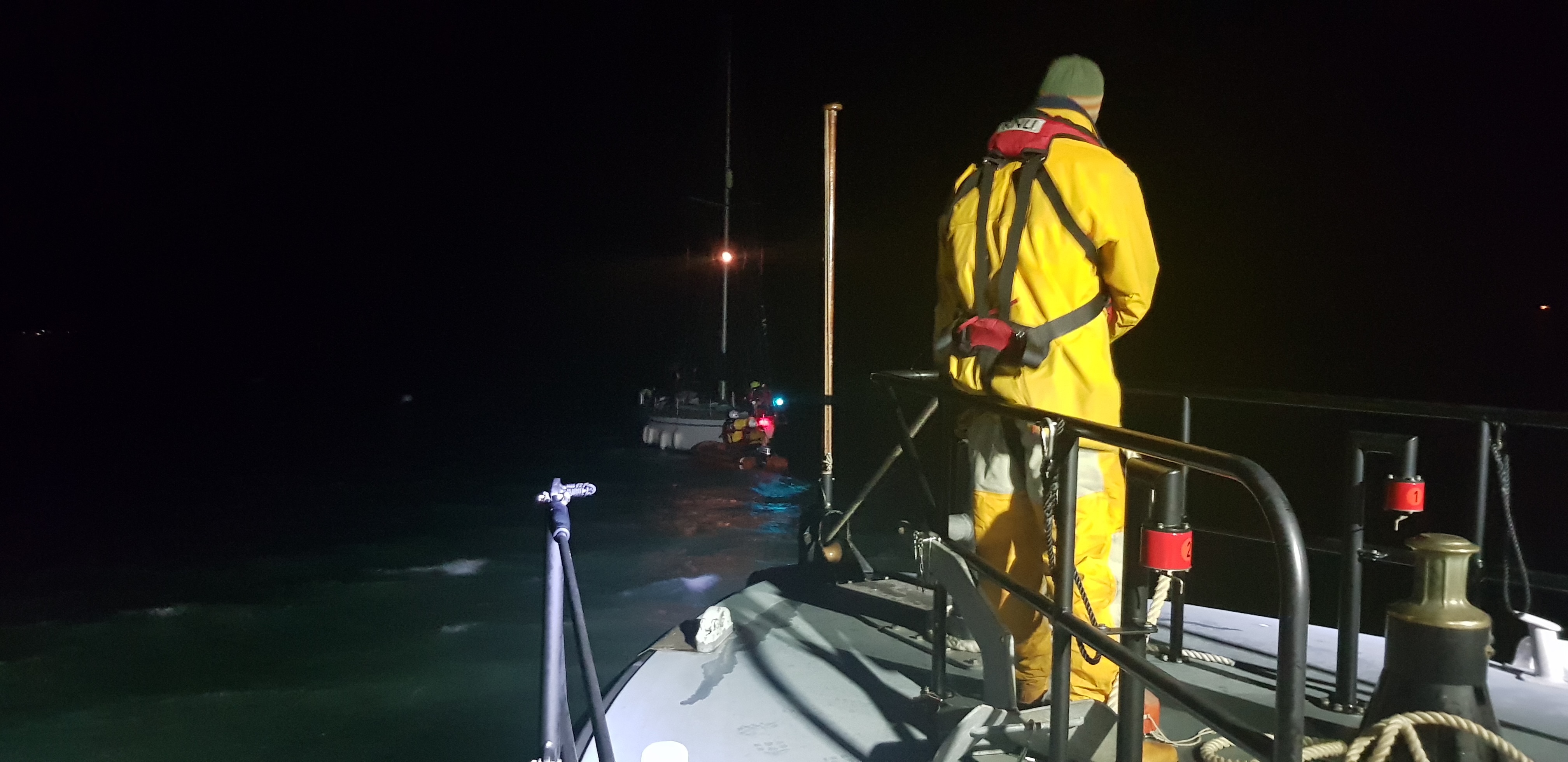 RNLI Yarmouth lifeboat assisting a yacht with a fouled prop