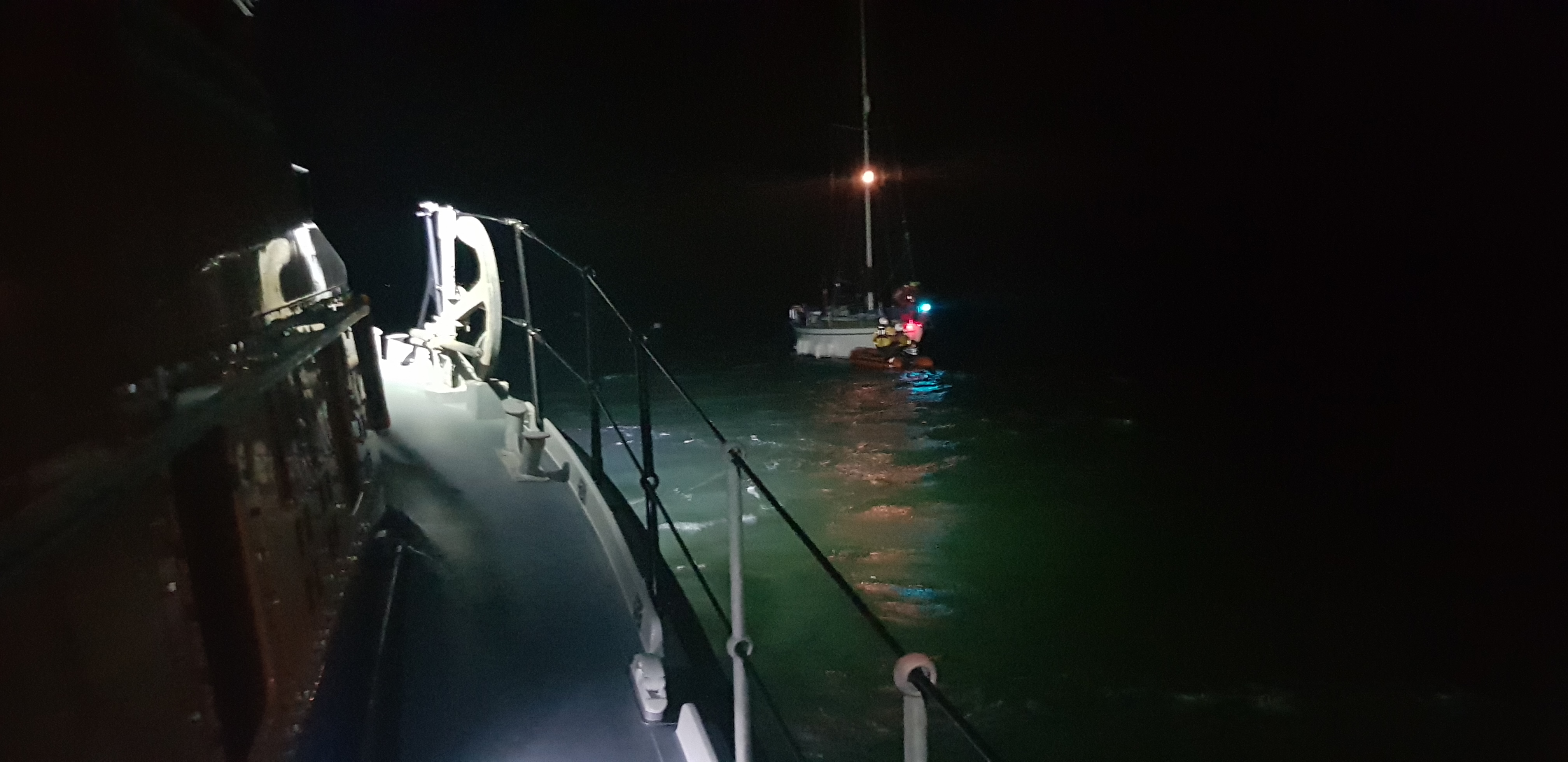 RNLI Yarmouth lifeboat assisting a yacht with a fouled prop