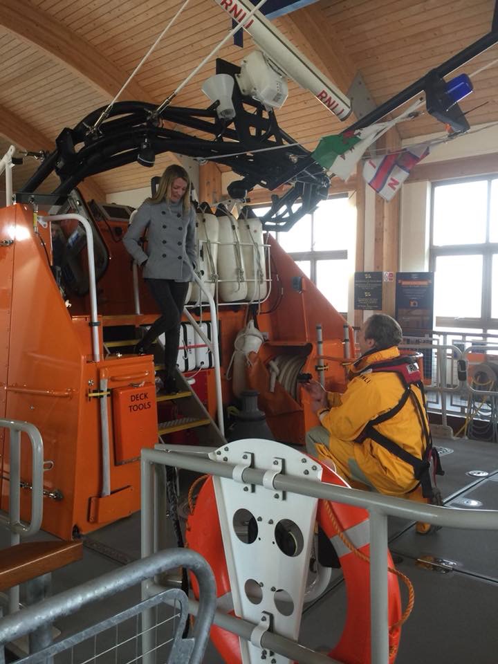 On the deck of the Tamar lifeboat on blended kneeboarding as Donna Dec ends onto the deck down the stairway.
