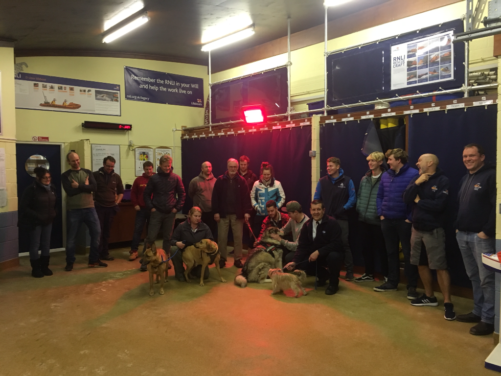 Volunteer crew at Rock RNLI meet staff and dogs from the RSPCA