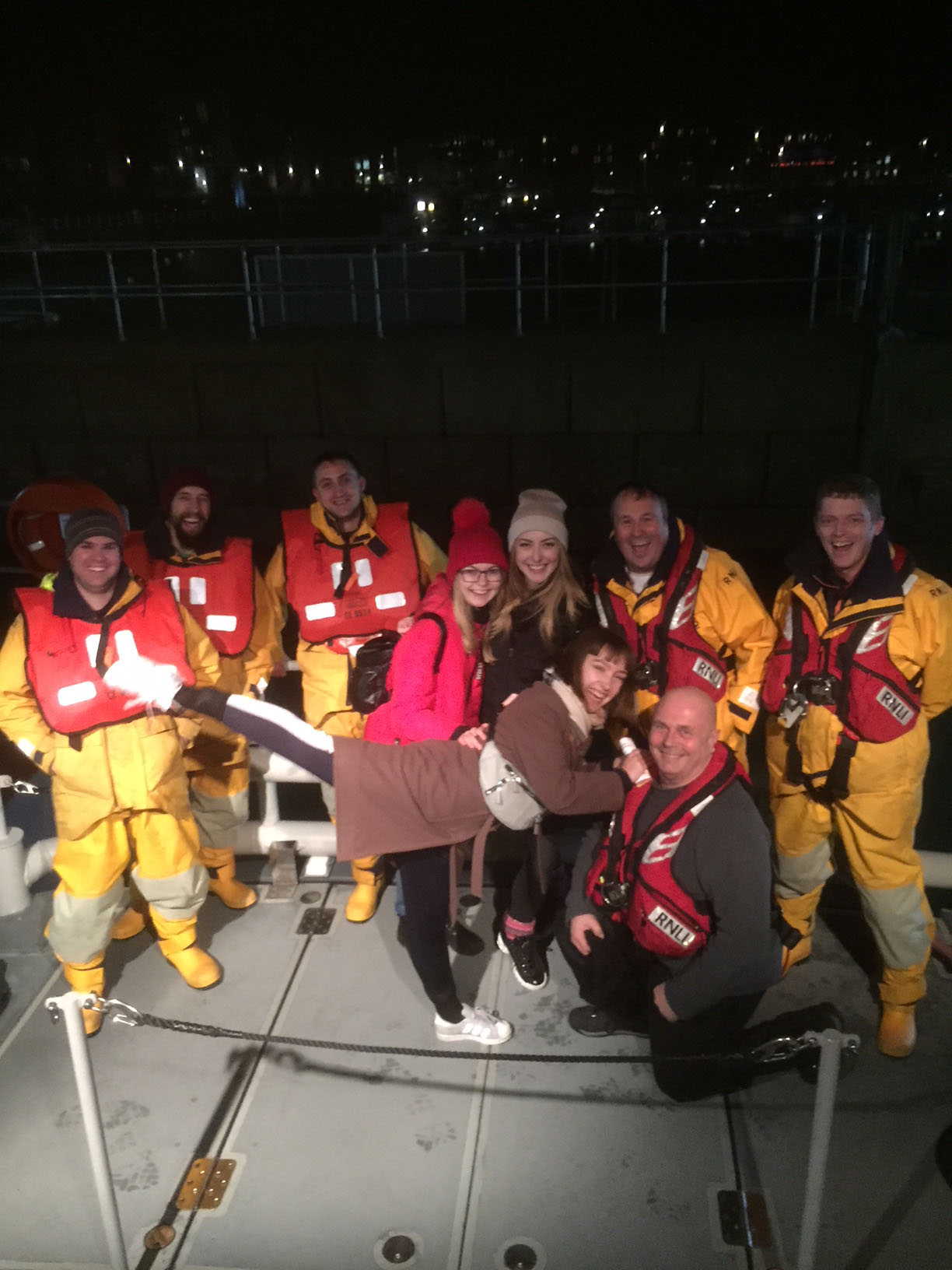 The three Russian ballerinas pictured with the crew of the all-weather lifeboat