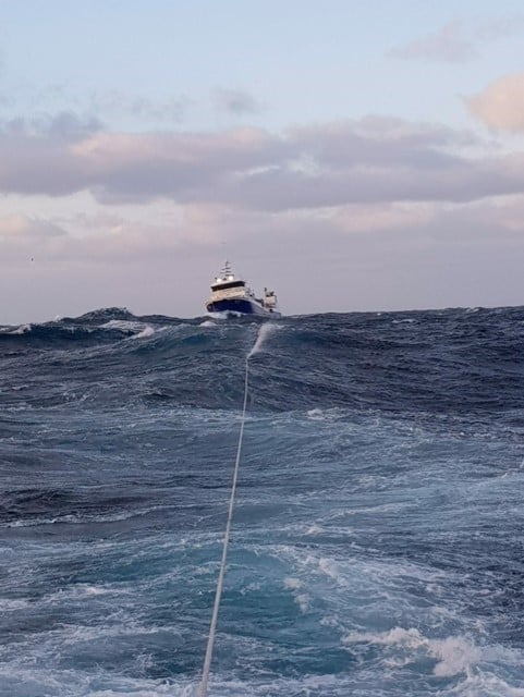 Migdale under tow in rough seas