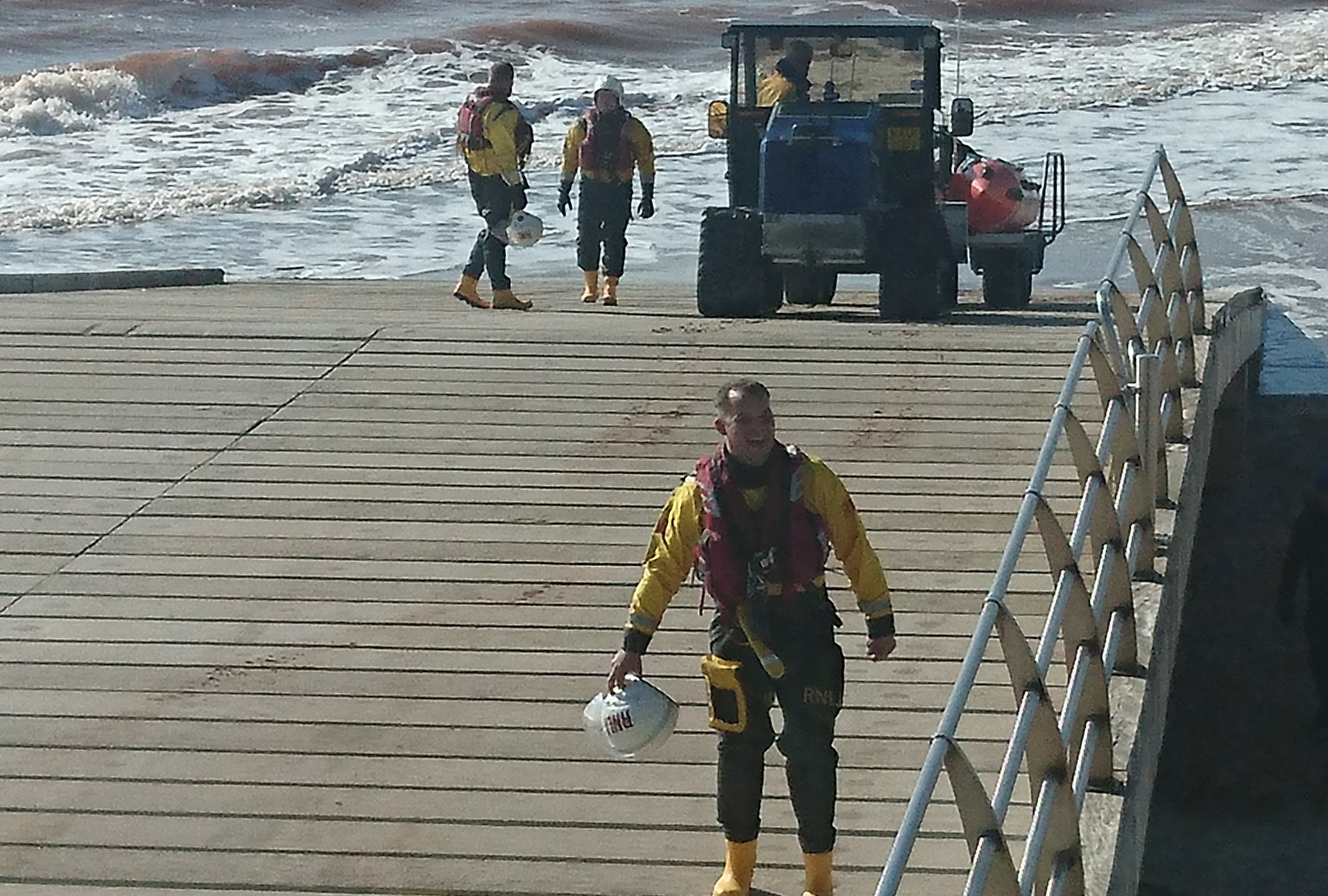 Crew volunteers returning after kite-surfer rescue with inshore lifeboat George Bearman II