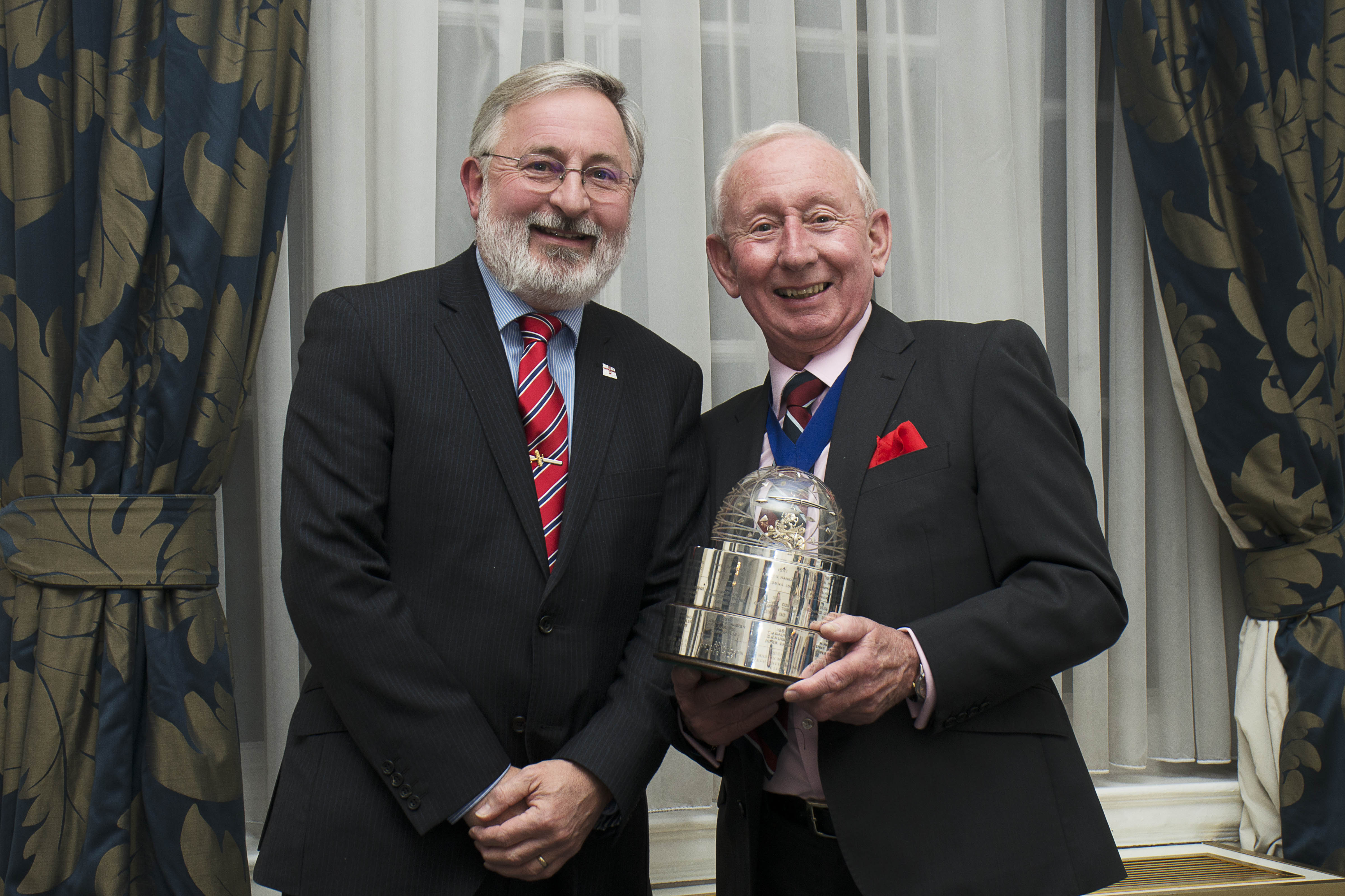 Ian Butter is presented with the Duke of Edinburgh Trophy at an awards dinner
