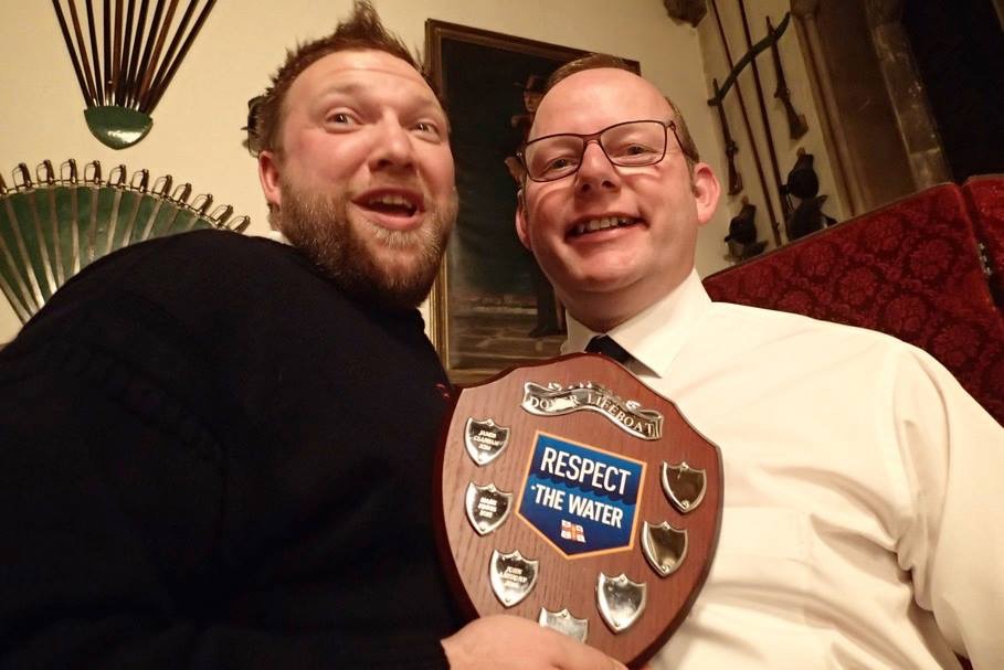 Darryl Cooper receives his Crewman of the Year award from Lifeboat Operations Manager Simon Moore