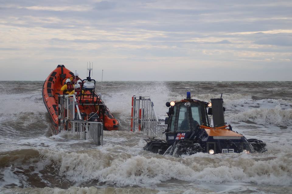 Tractor and lifeboat launching into the surf on one of the eighteen shouts during 2017