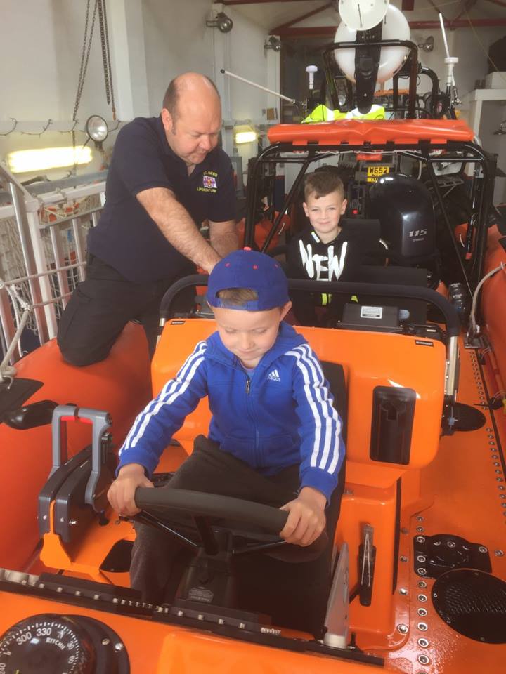 Children during one of the many school visits enjoy a look round the lifeboat.