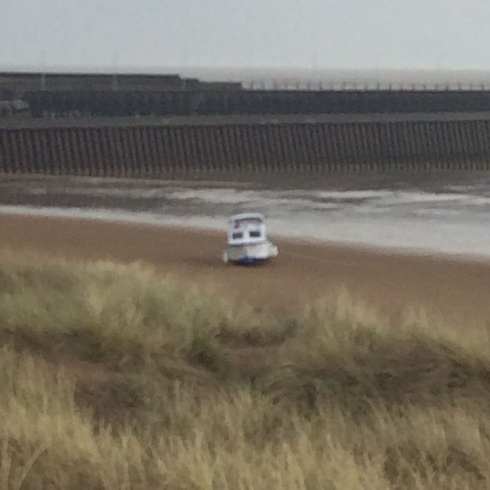 23ft boat dragged anchor and Is stranded at the high water mark