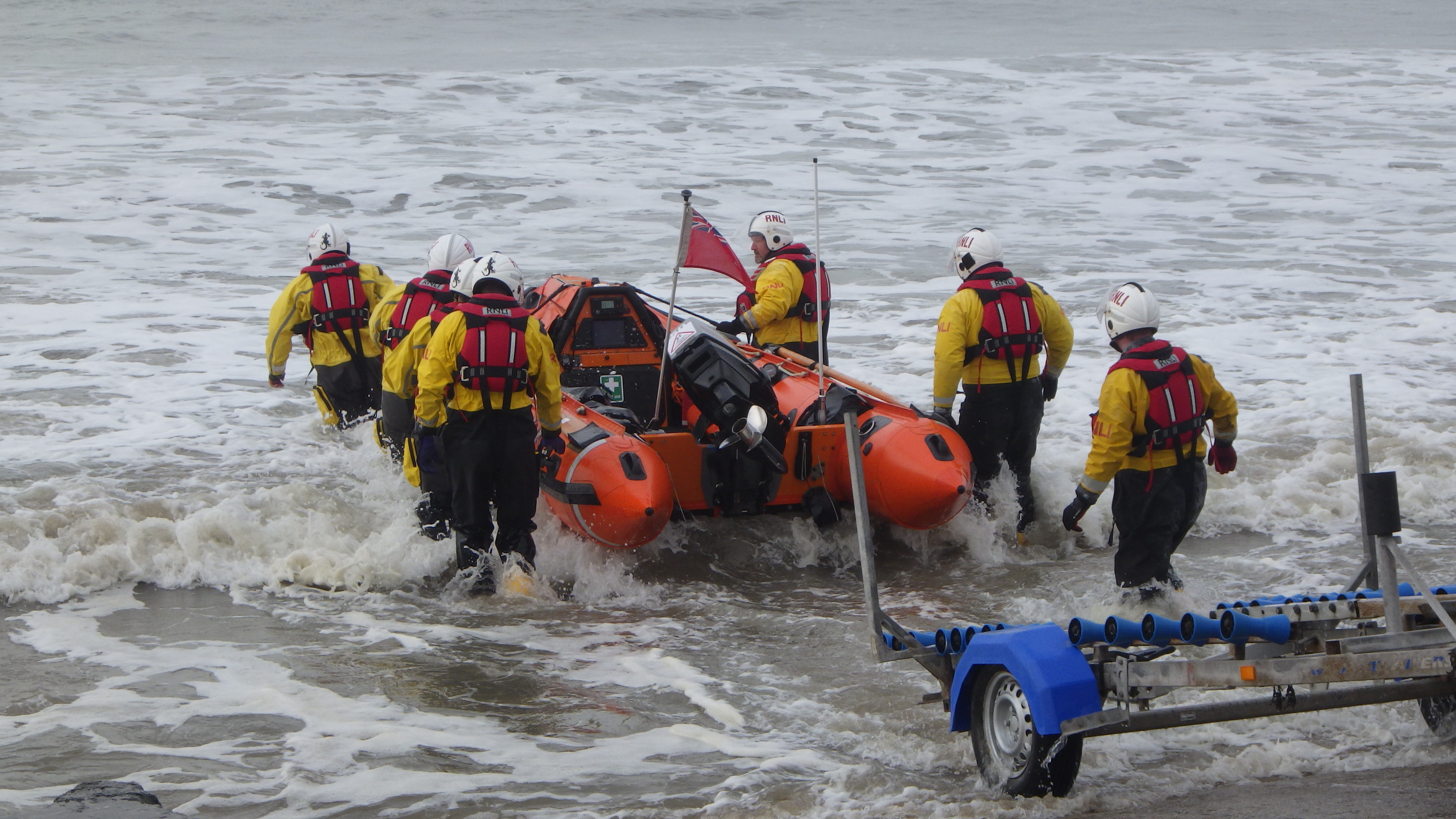 The lifeboat being placed into the water