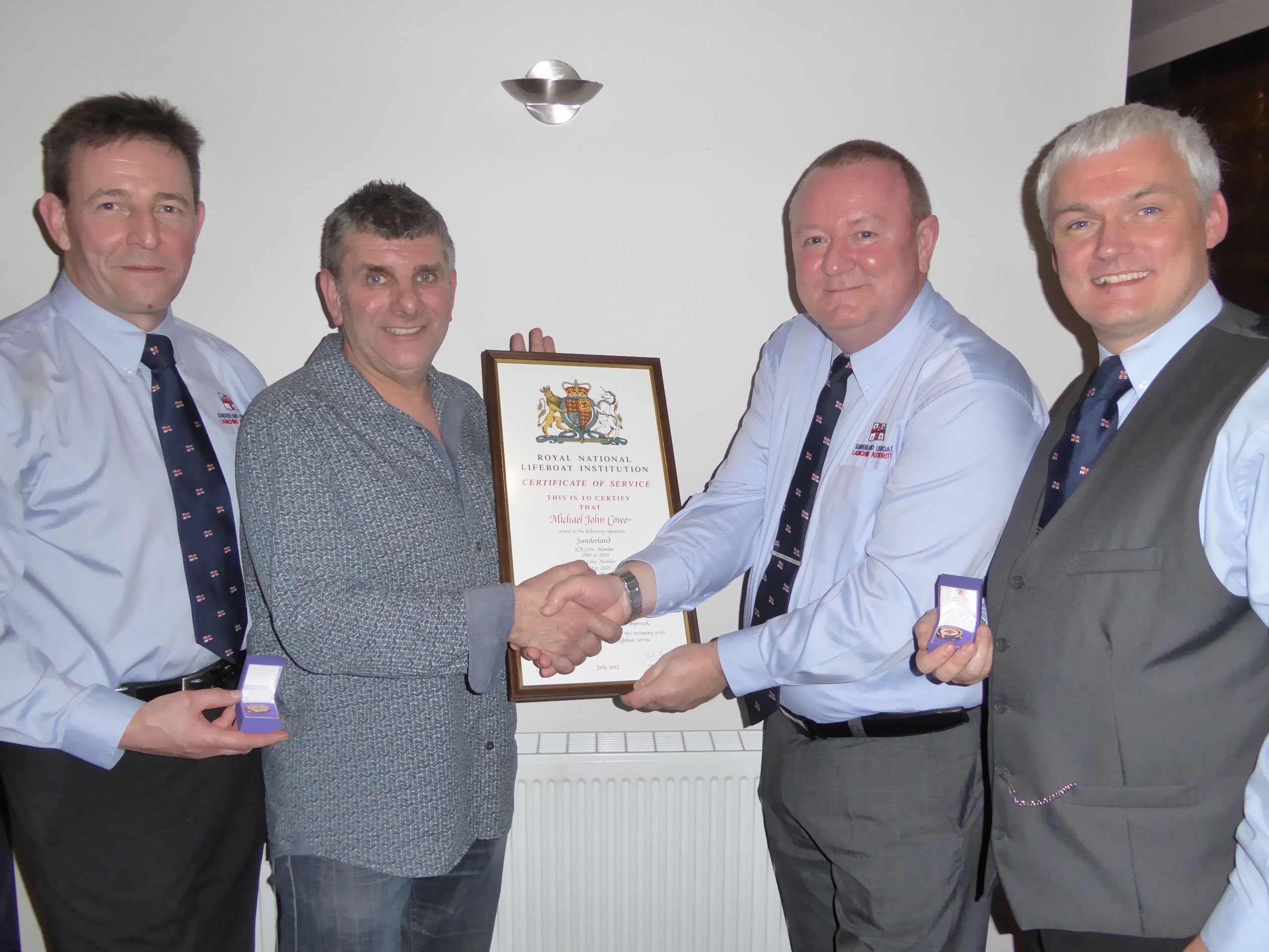 Martin Andrew (left), Paul Nicholson (right), and Mike Cowe (middle right) with Operations Manager James Jamieson (middle left).