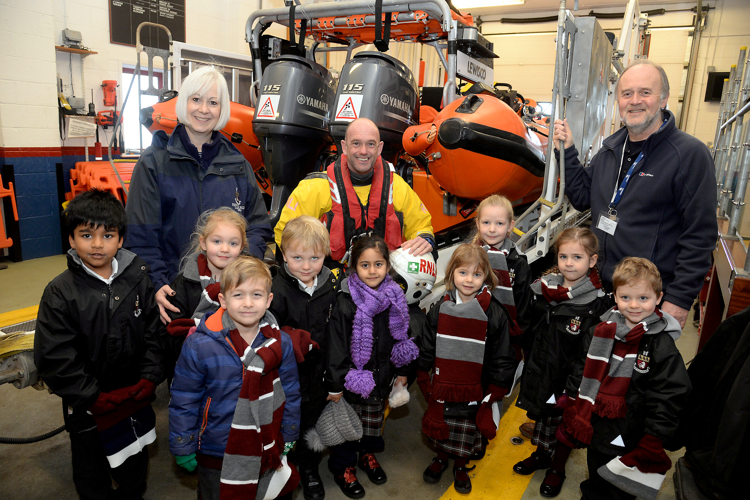 Whitstable Lifeboat Visits Officer David Hayward, right and Crewmember Adrian Woolrich-Burt show the Kent College Reception Class with Teacher Ruth McSweeney around the lifeboat station. Picture: RNLI Whitstable