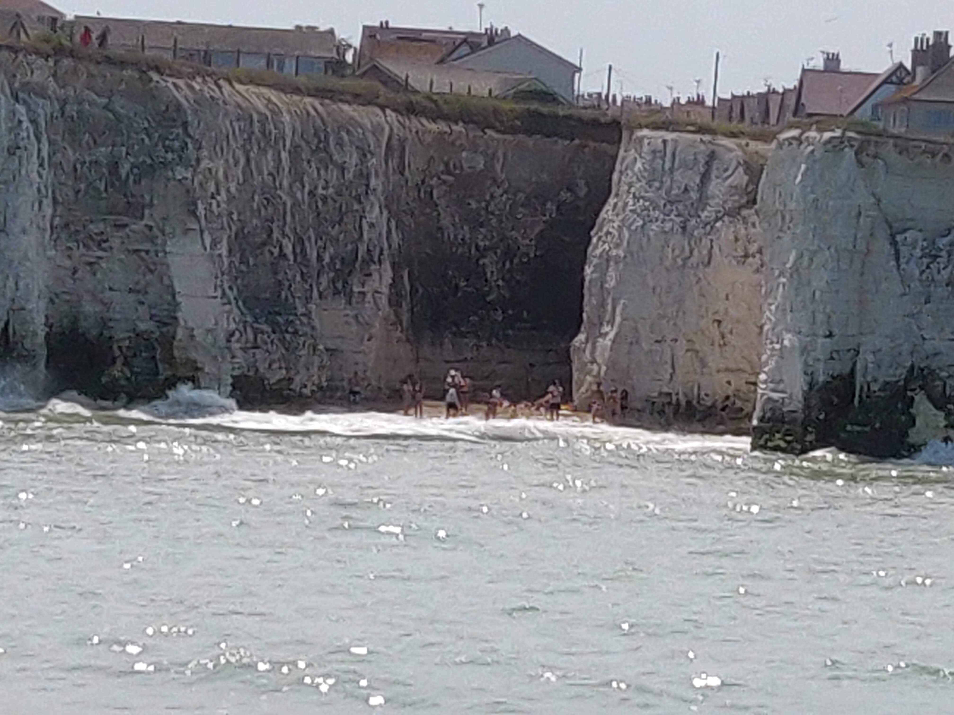 Beach-goers cut off by the tide