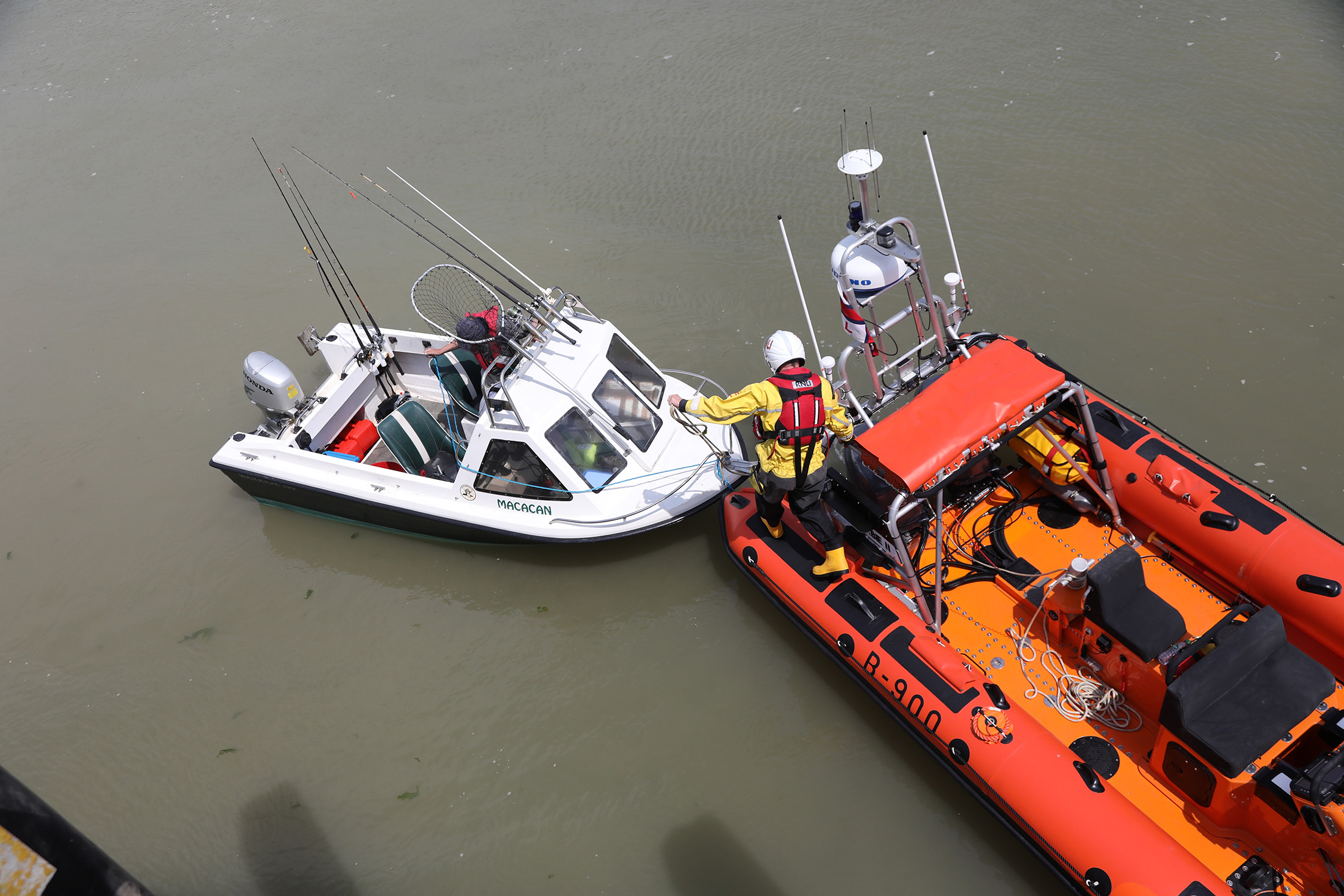 vessel and lifeboat in harbour