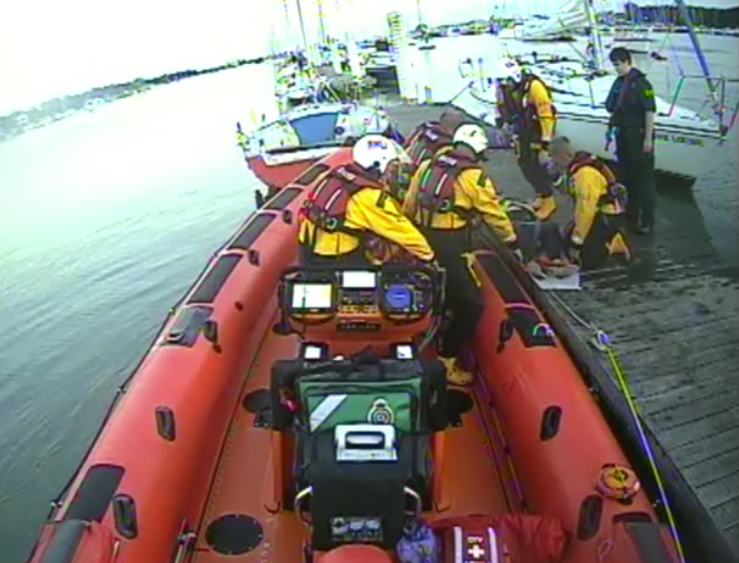Calshot RNLI transferring casualty to Atlantic 85 Lifeboat