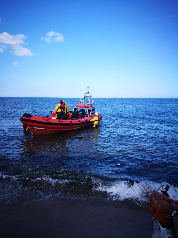 Lifeboat lands the casualty into the care of Newbiggin and Amble Coast Rescue Teams